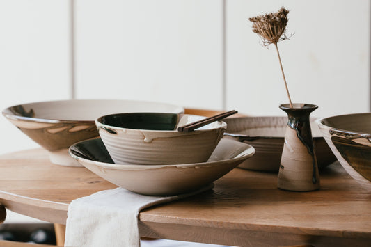 Elegant table setting showing ceramic bowls and vase for product photography
