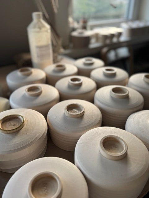 Batch of handmade ceramic pieces in progress — each one factored into pricing time and labor costs