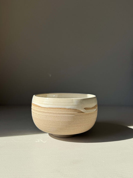 Handmade ceramic Matcha Bowl – Yuki Series #03 with toffee clay and white glaze finish on display.