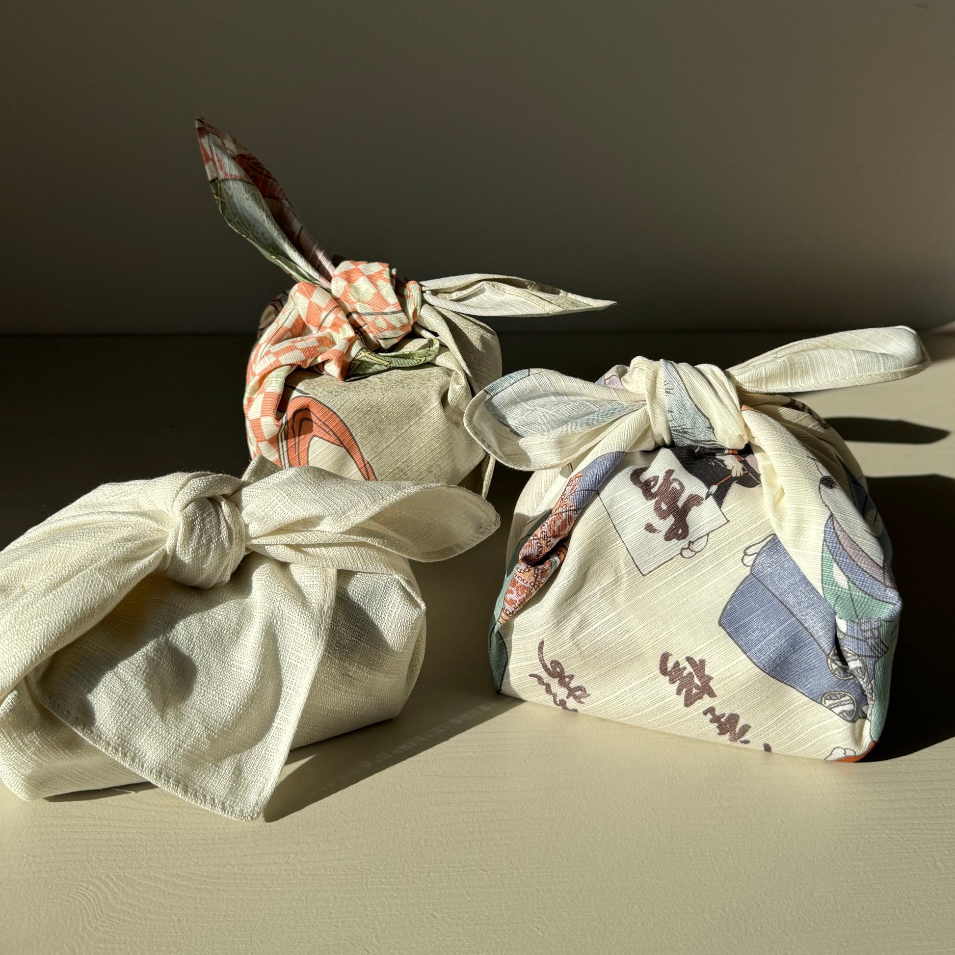 three furoshiki wrapped presents 