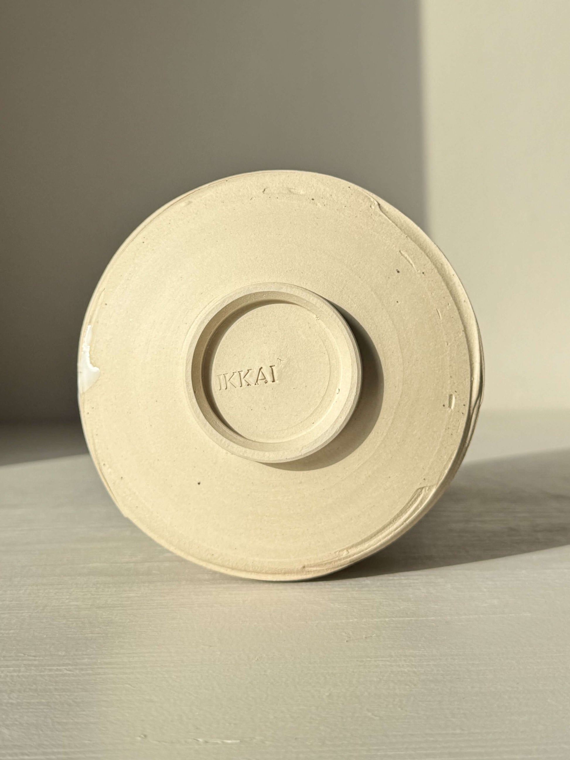 Base view of Matcha Bowl – Half Glossy White Glaze #02 handmade ceramic, highlighting speckled stoneware and wheel impressions.