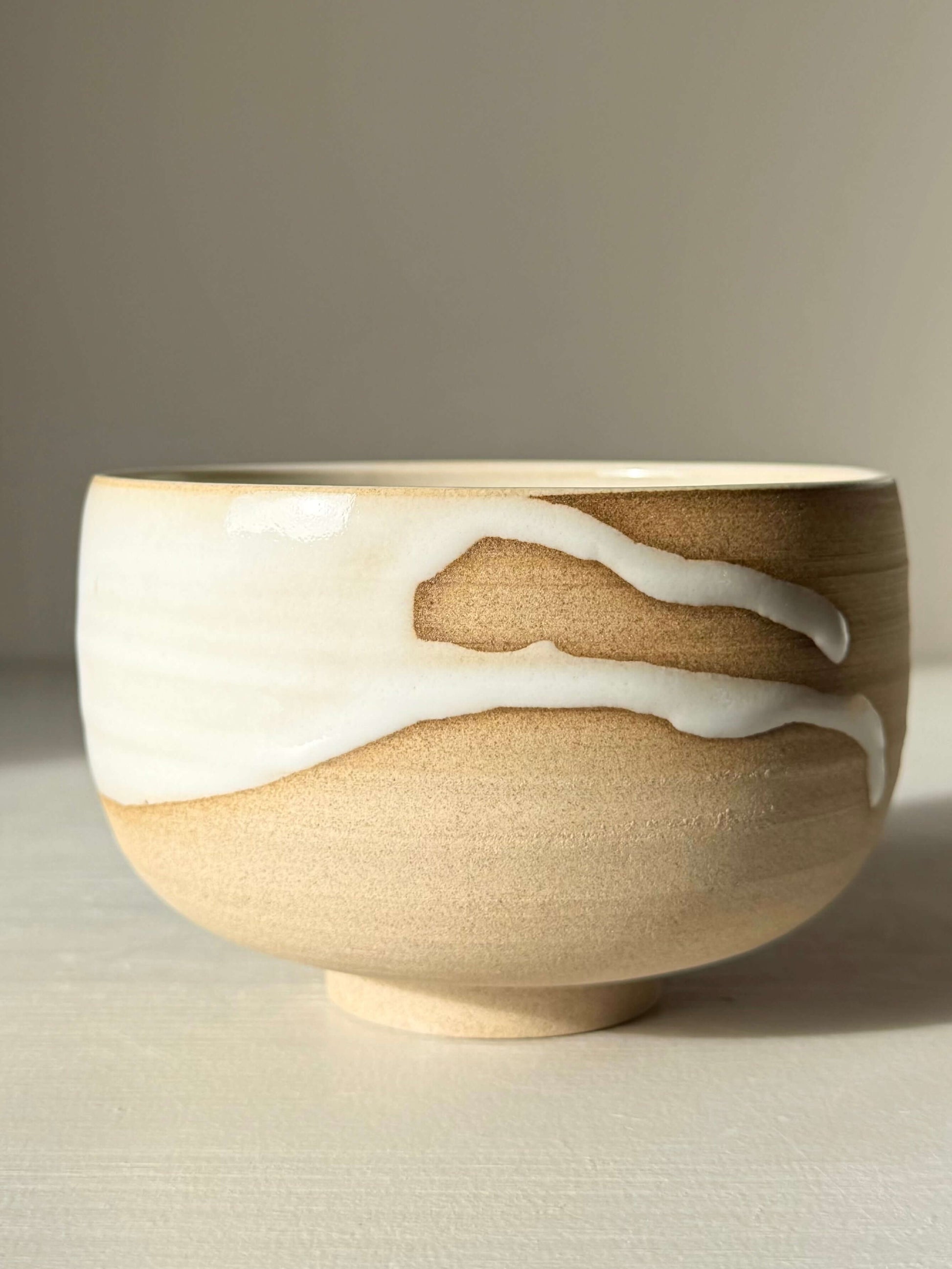 Matcha Bowl – Yuki #04 handmade ceramic with toffee clay and white glaze, showcasing unique artistic drips for a calming daily ritual.