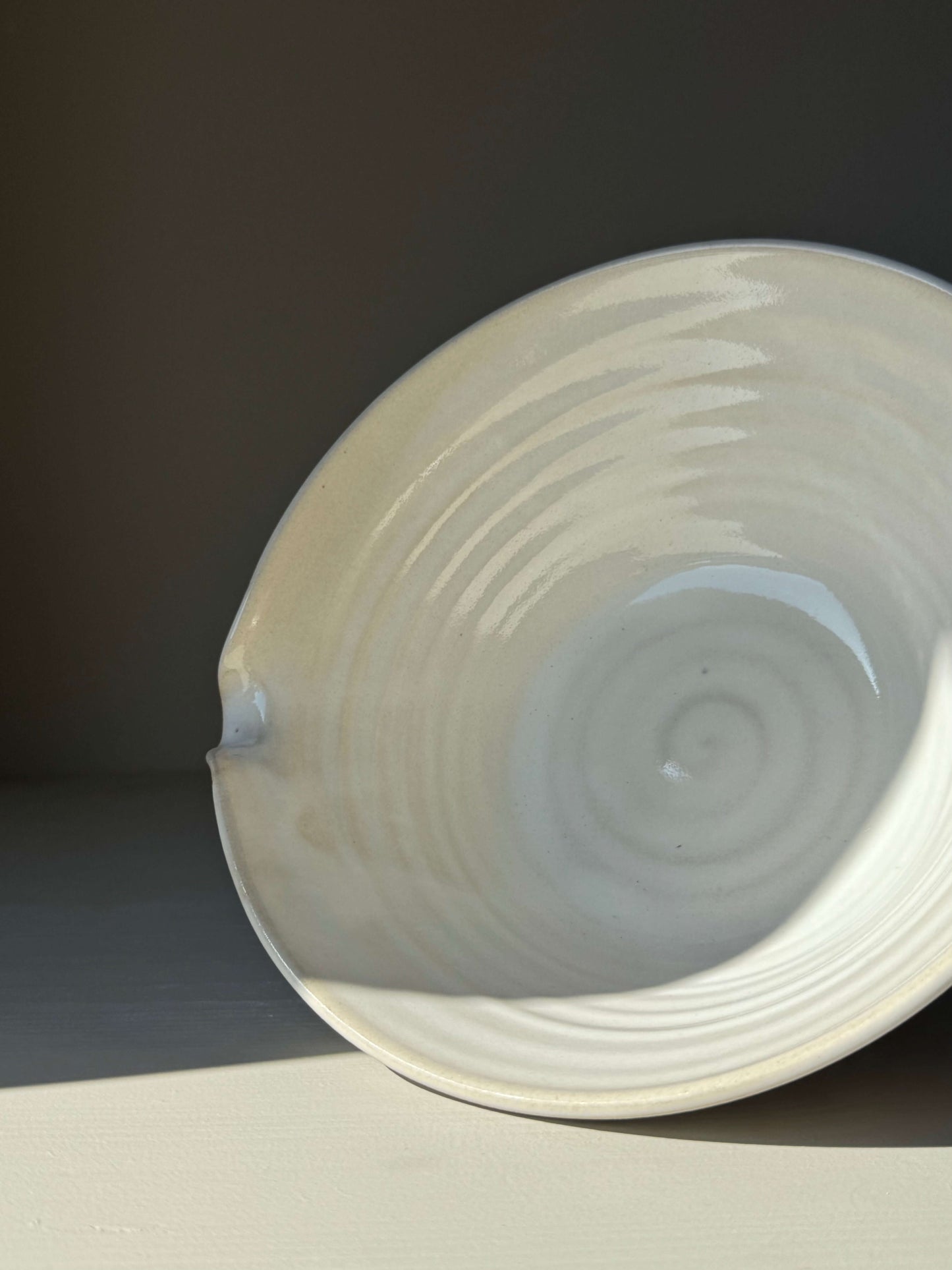 Pouring Bowl – Yuki Series handmade ceramic with textured spiral design and curved spout.
