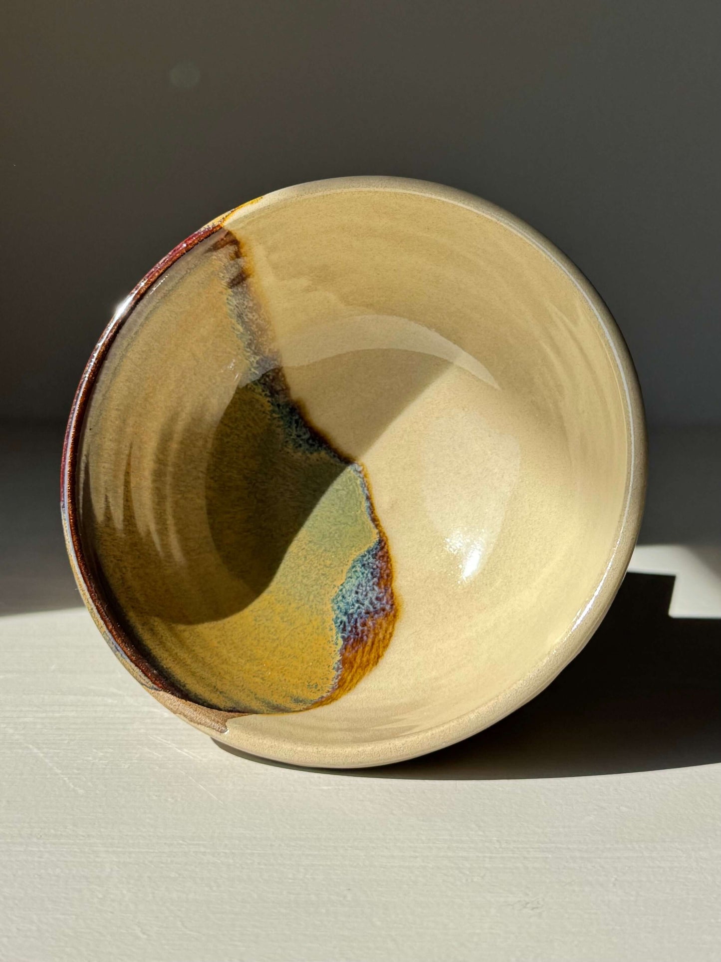 Handmade Small Bowl - Inyo Series with tenmoku glaze, showcasing a blend of black, bronze, and cream tones.