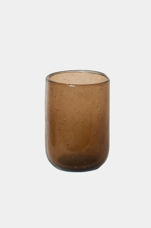 Bari Glass – Brown with tiny bubbles, unique rounded shape, perfect for water or juice, offering a calm and natural grip.