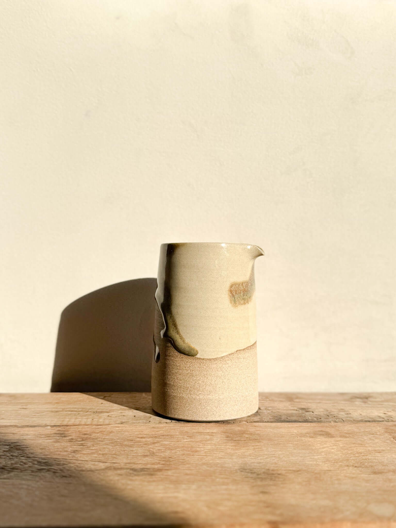 Inyo Series #02 sculptural vase with raw texture and flowing glaze, usable as a vase, water jug, or studio tool holder.