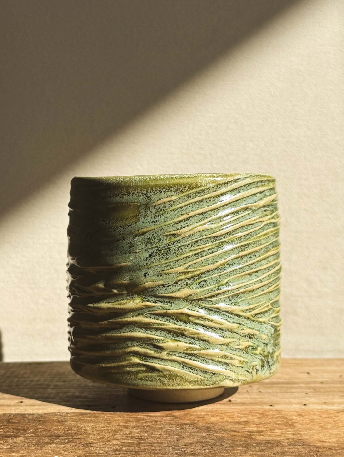 Wasabi Green Yunomi Cup with textured, flowing design and subtle shine, approx. 8 cm high, 7.5 cm wide, 300 ml capacity.