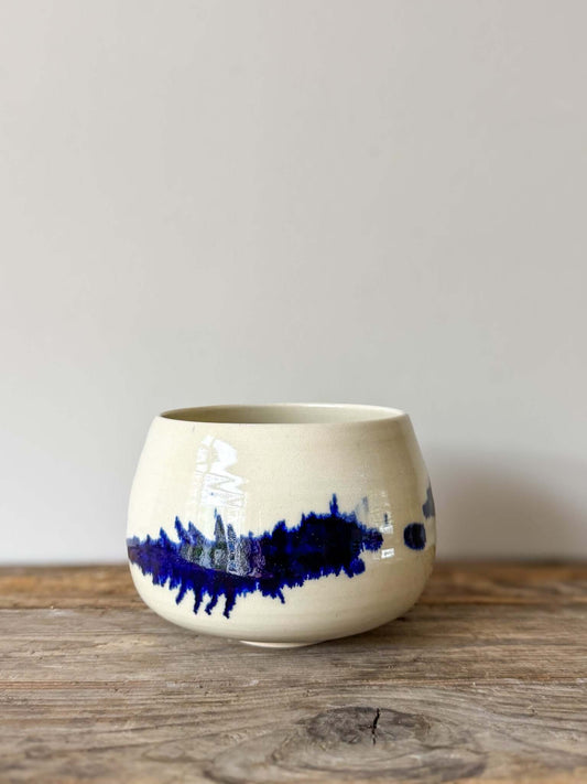 Gosu Series #02 matcha bowl with cobalt glaze and rounded shape on wooden surface.