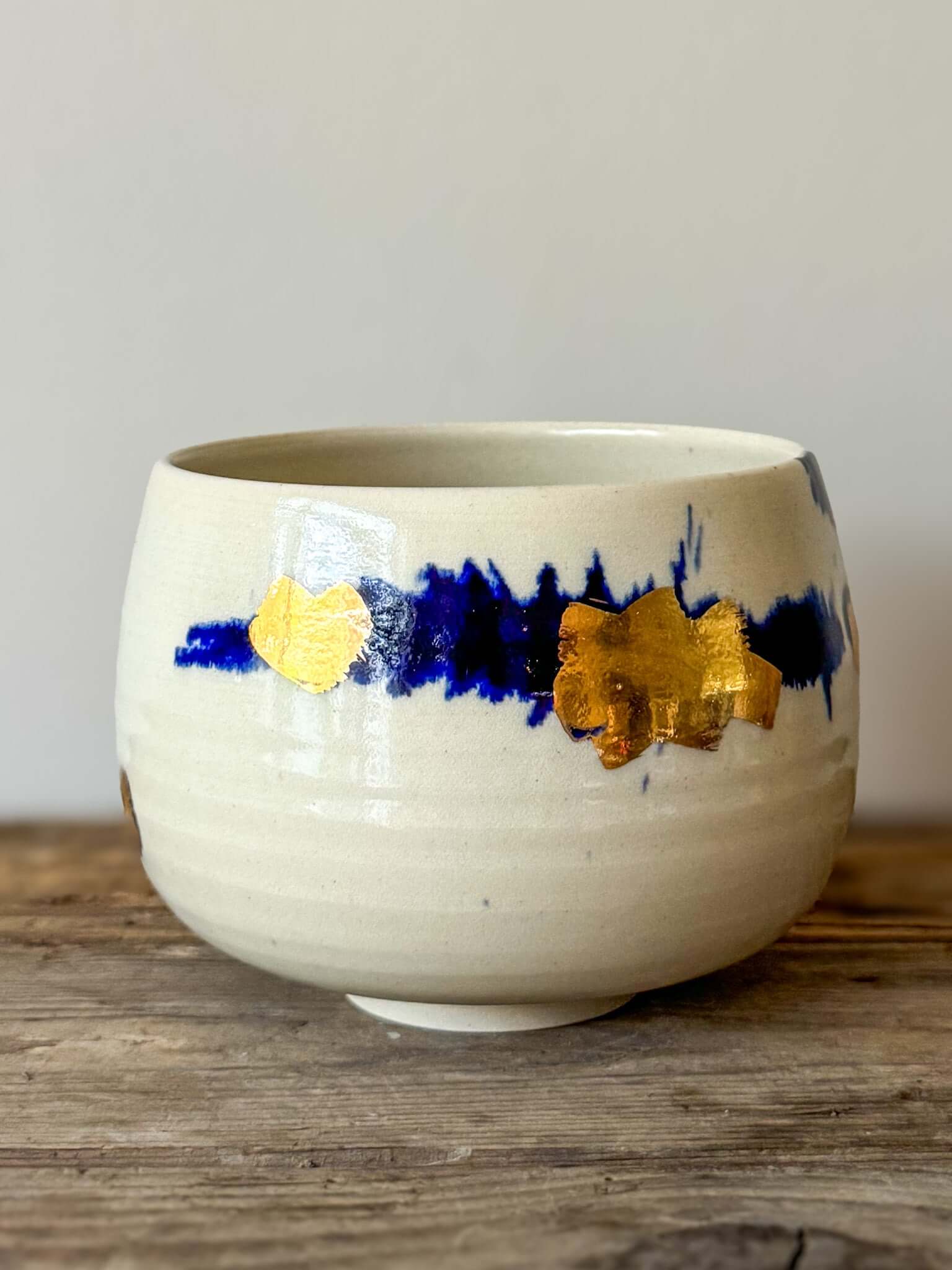 Rounded Matcha Bowl from Gosu Series with cobalt glaze and gold leaf accents, creating a serene and bold artistic contrast.