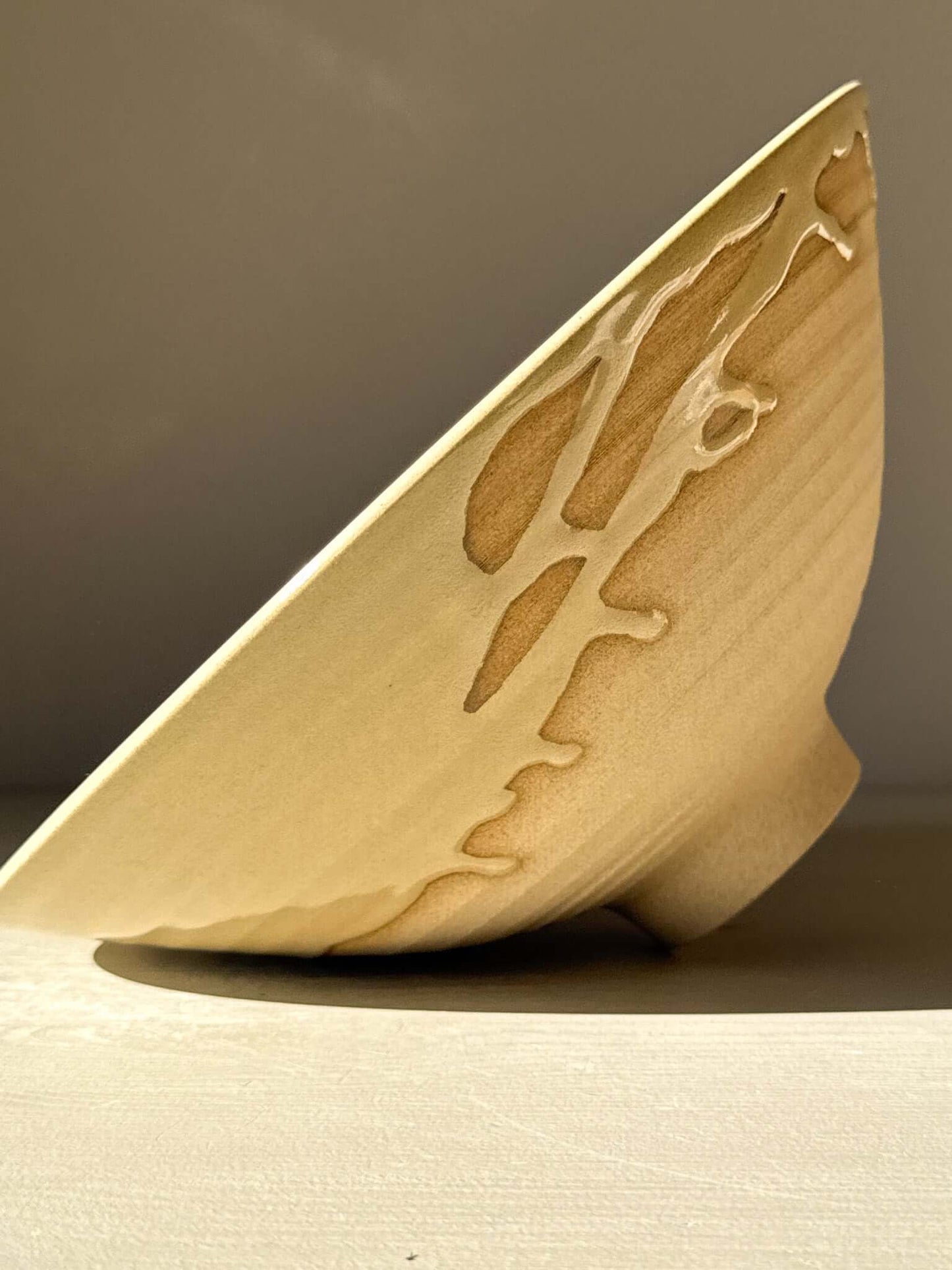 Side view of Medium Bowl - Inyo #01 showcasing its raw, carved exterior with artistic drips along the rim.