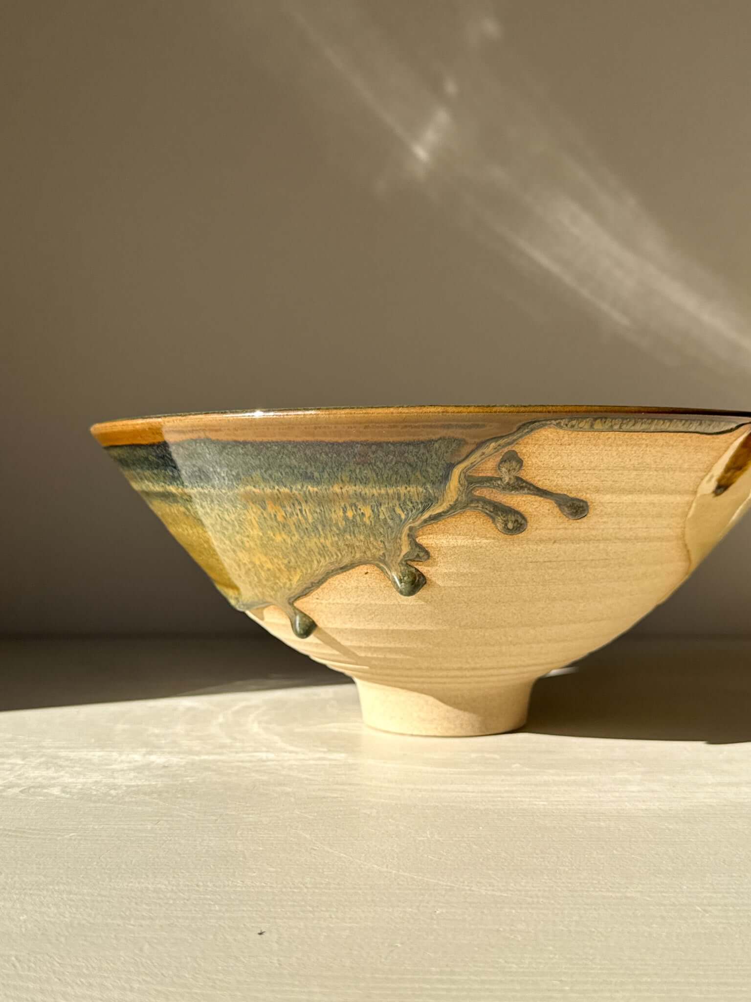Medium Bowl - Inyo #01 with golden tones and sculptural design, showcasing a carved exterior with expressive drips along the rim.