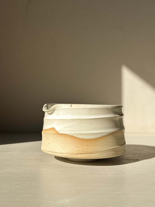 Matcha Bowl with Spout – Glossy White #02 with a tactile stoneware finish, showcasing natural clay tones and white glaze drips.
