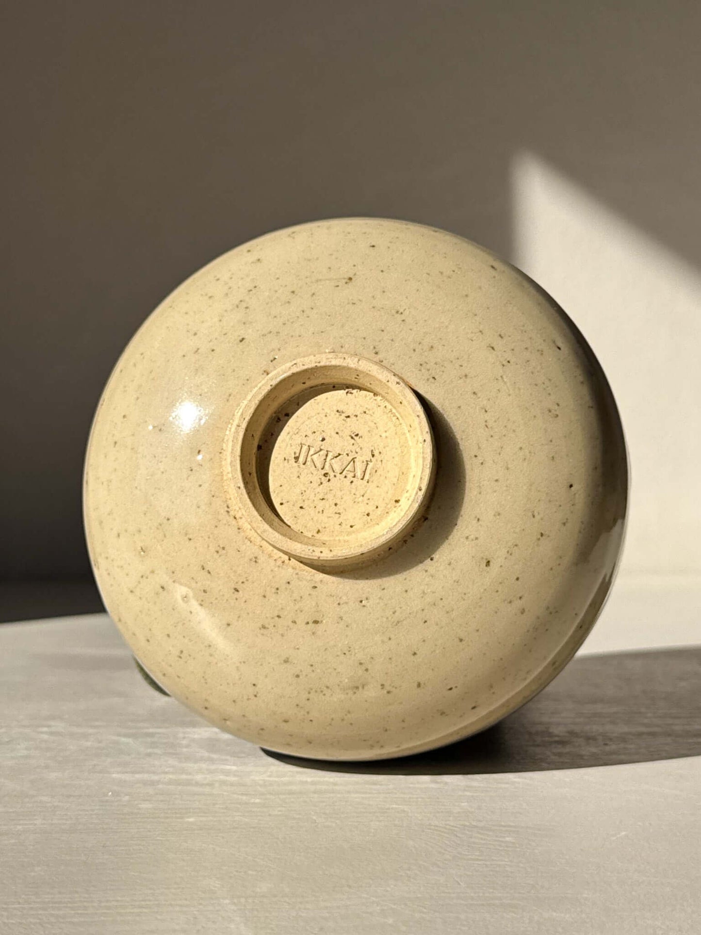 Bottom view of Matcha Bowl with Spout - Green Rim #03 displaying its traditional Japanese Katakuchi style in natural light.