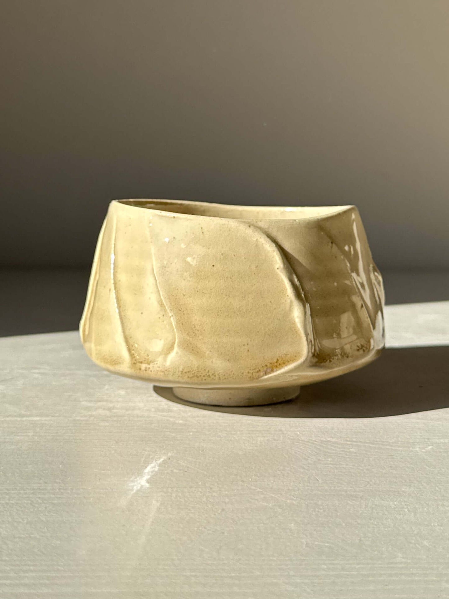 Yunomi Cup - Beige with soft glaze and textured slip design, showing gentle color variation and depth.