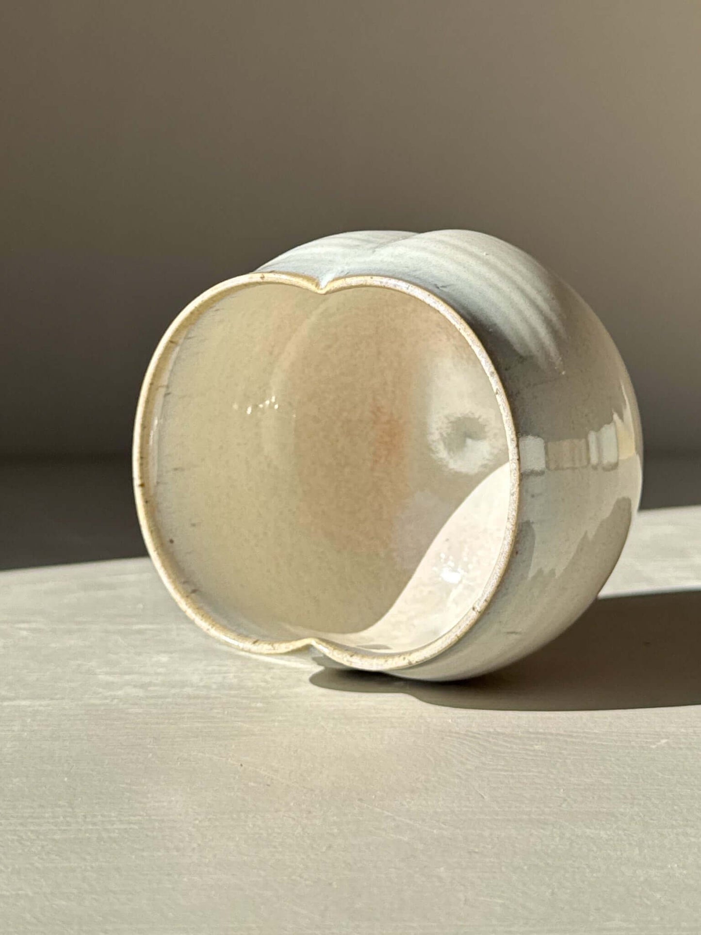 "Yunomi Cup - Pale Blue with soft glaze and rounded shape, displaying delicate folds and subtle color shifts"