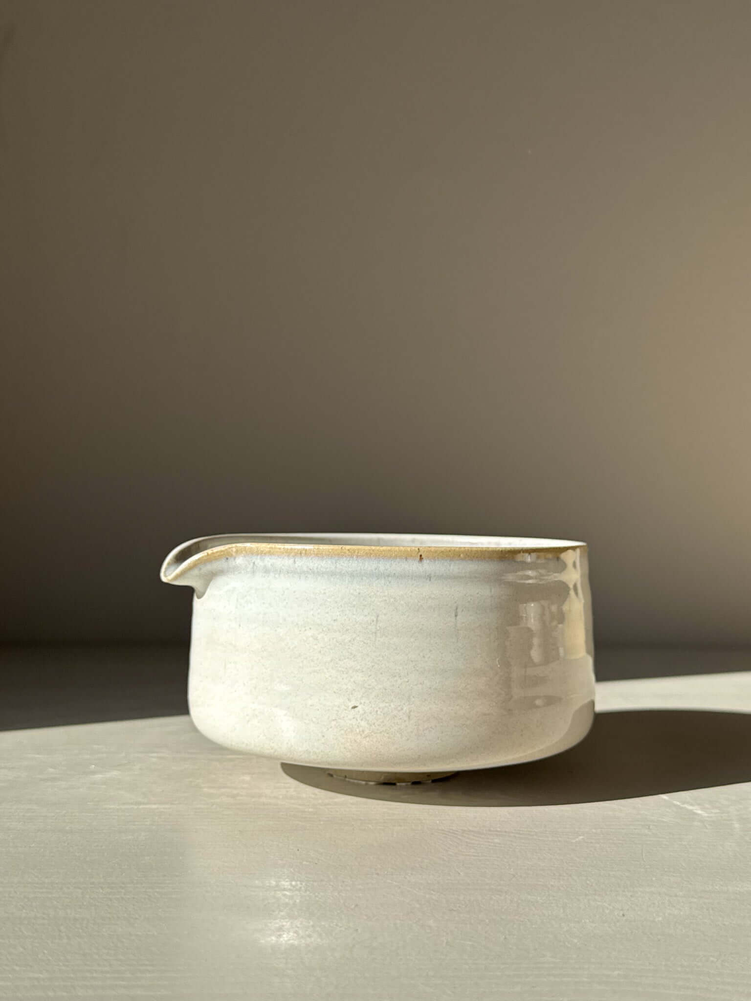 Matcha Bowl - Pale Blue with soft glaze and pouring lip, showcasing a calm, misty surface and unique open shape, pottery art piece.