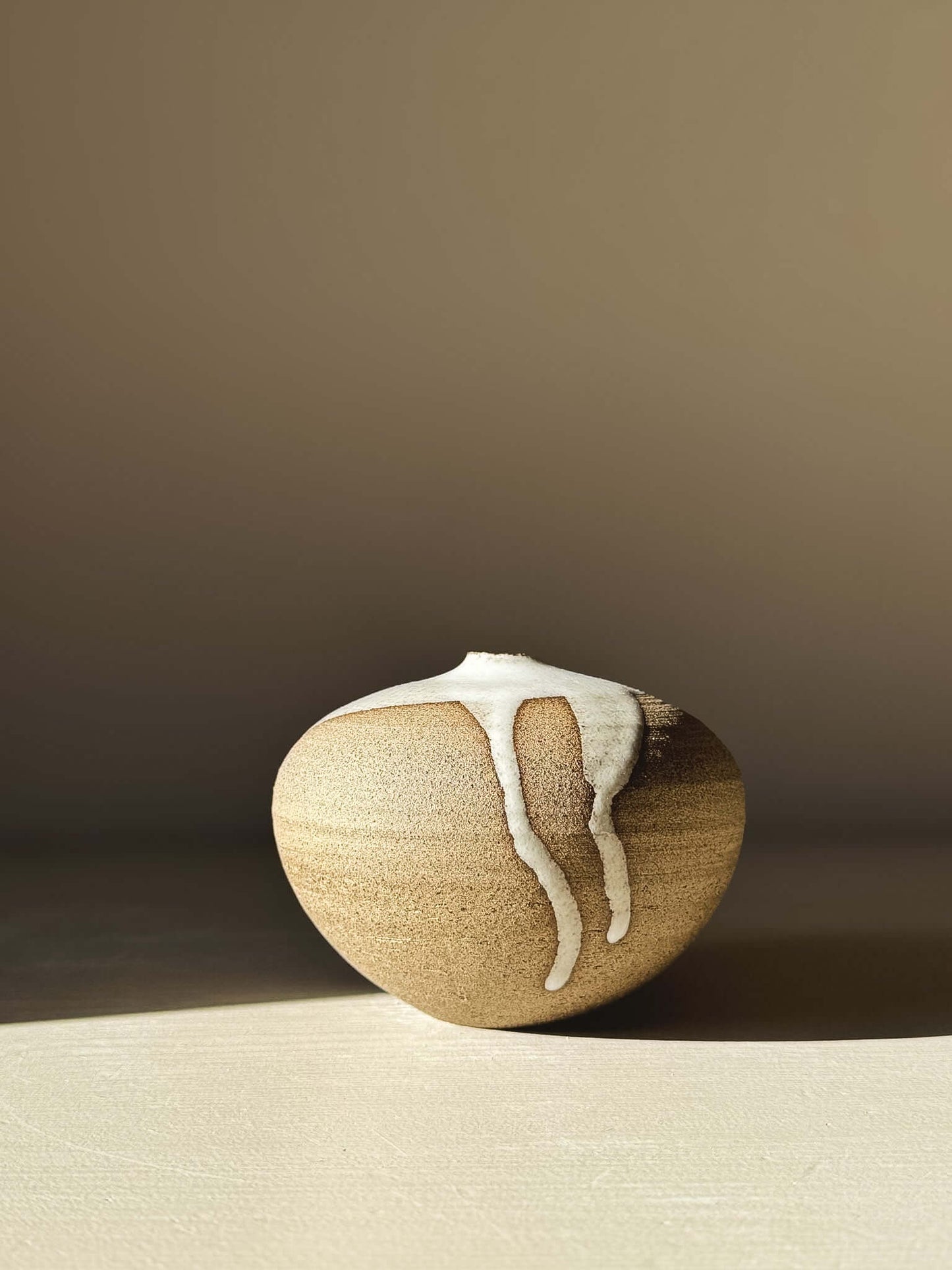 Orb Vase – #08 with unique organic glaze pattern on a rounded clay form