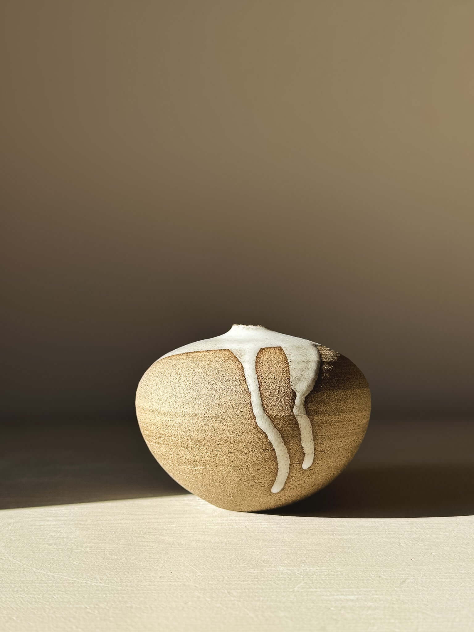 Orb Vase – #08 with unique organic glaze pattern on a rounded clay form