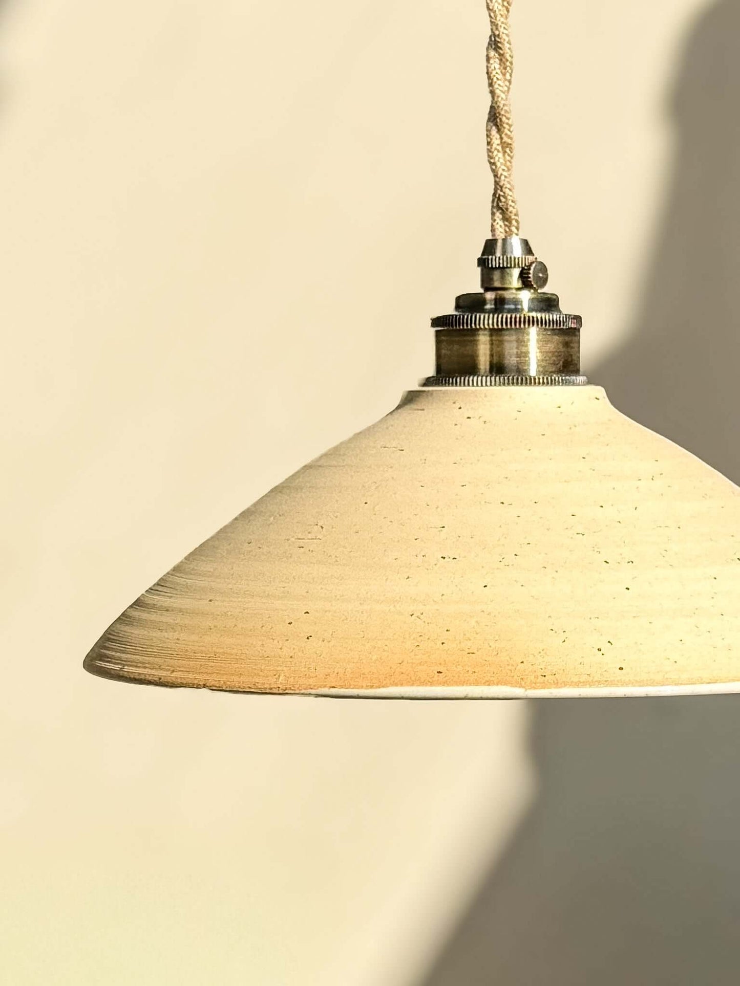 Ceramic Lamp Shade – Half Glossy White Glaze #02 with raw exterior and glossy interior, enhancing light with warmth and texture.