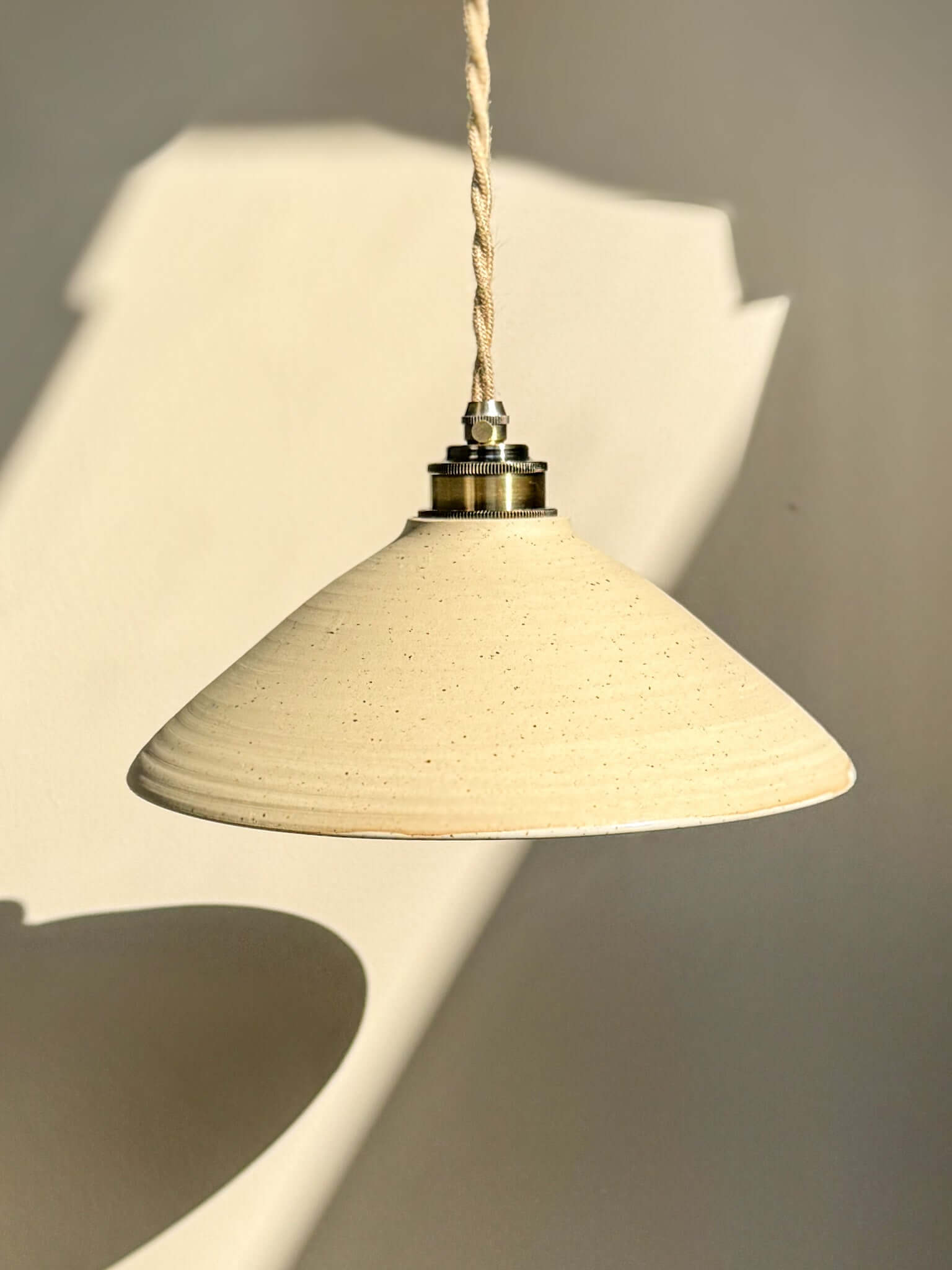 Hanging Ceramic Lamp Shade – Half Glossy White Glaze #03 with natural clay texture and glossy interior reflecting light.