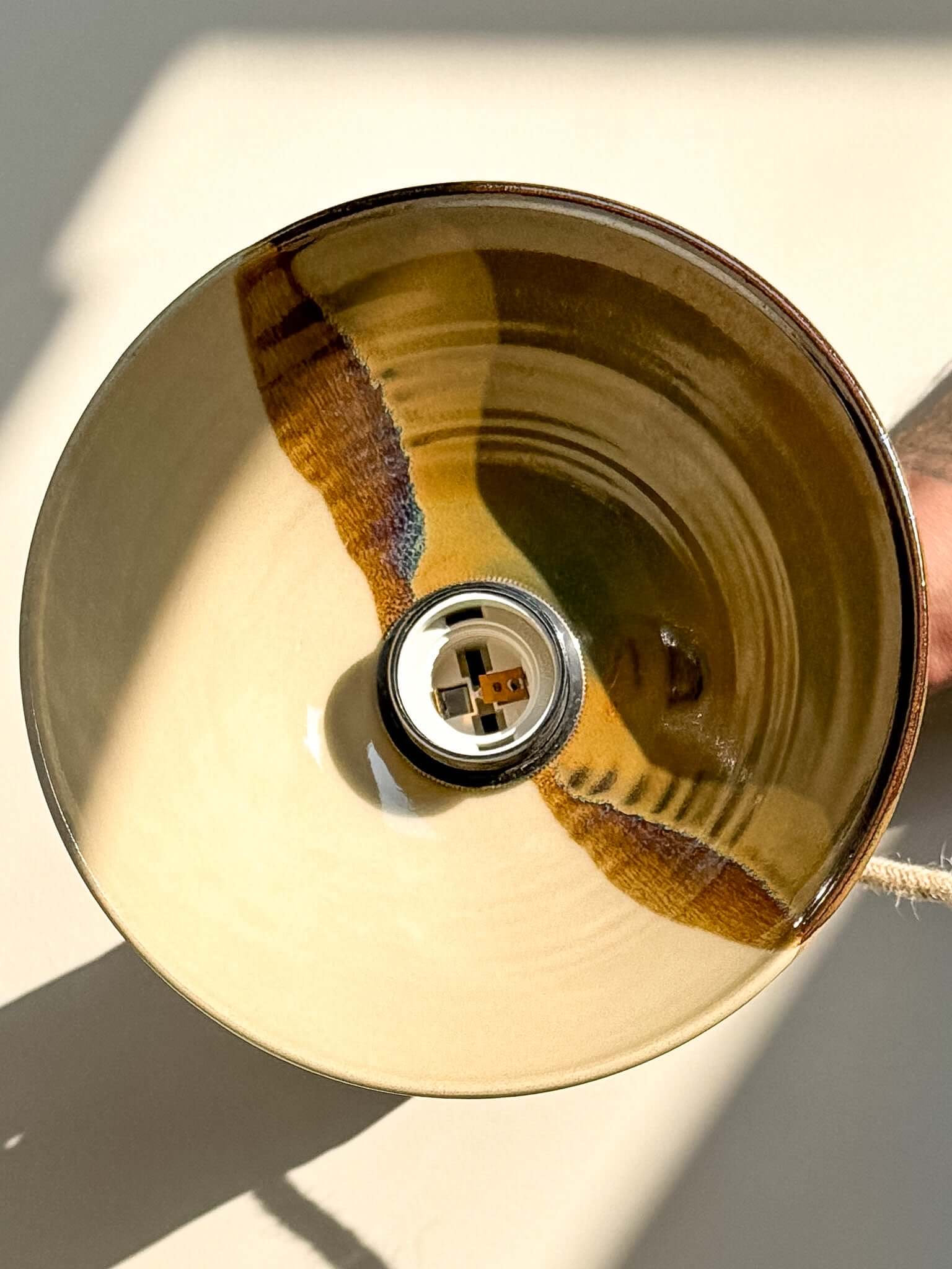 Ceramic Lamp Shade – Inyo #03 with bronze, amber, and deep blue glaze, natural matte exterior, and flowing drip design.