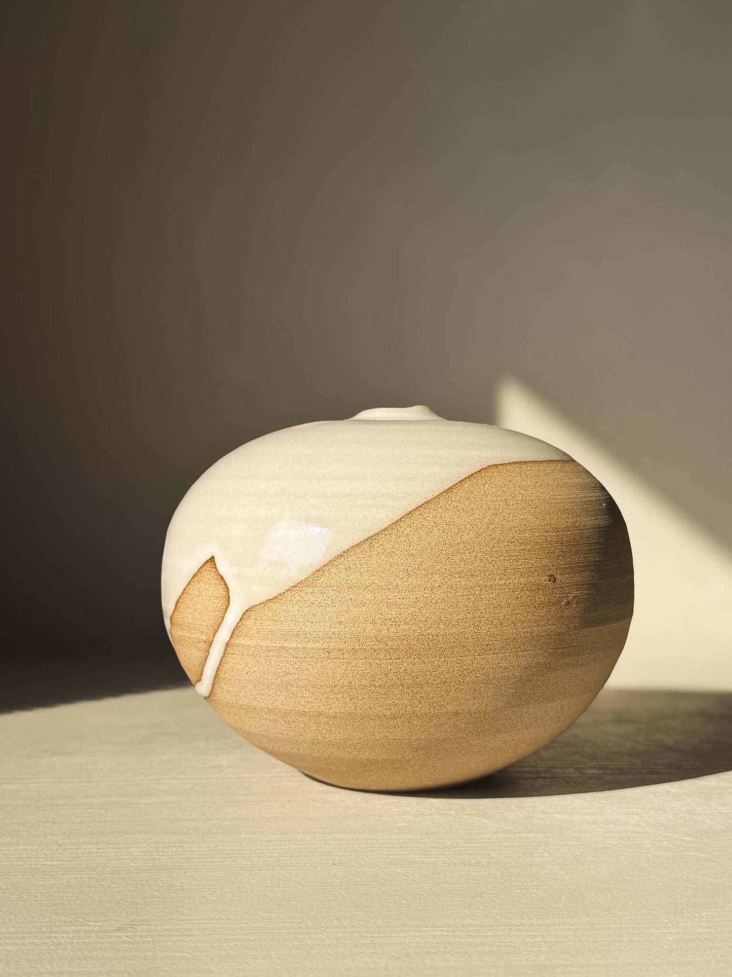 Handcrafted Orb Vase – #16 with smooth glaze drips and organic patterns on a rounded, sculptural form, part of a new collection.