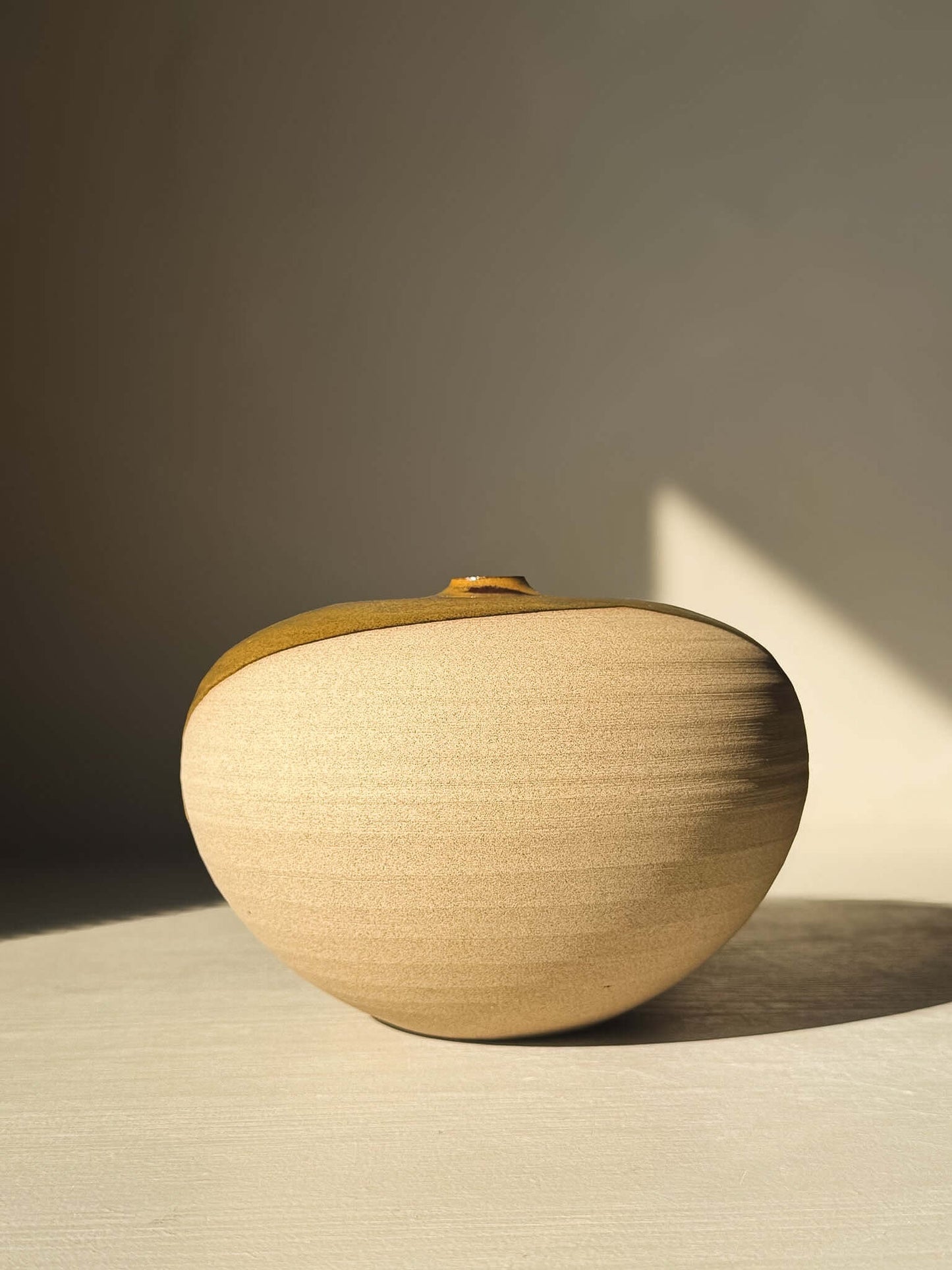 Orb Vase – #15 with natural glaze and organic patterns, showcasing a round sculptural form ideal for minimalist decor.