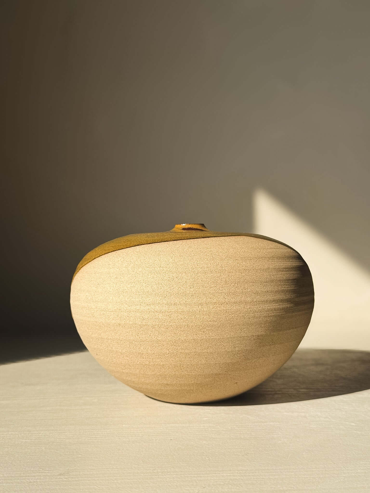 Orb Vase – #15 with natural glaze and organic patterns, showcasing a round sculptural form ideal for minimalist decor.