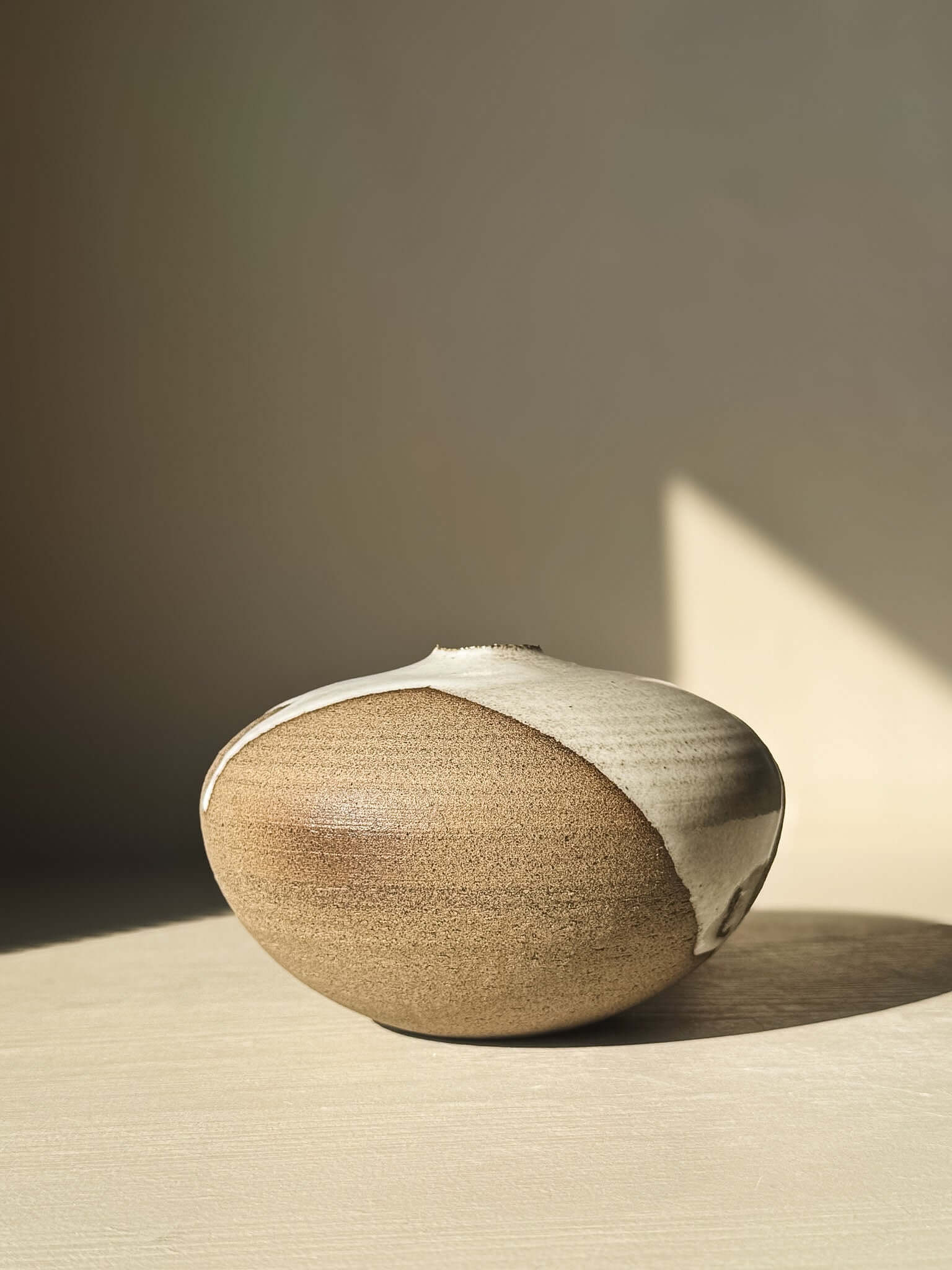 Orb Vase – #13 with unique glaze drips and organic patterns, showcasing a soft, spherical, sculptural presence.