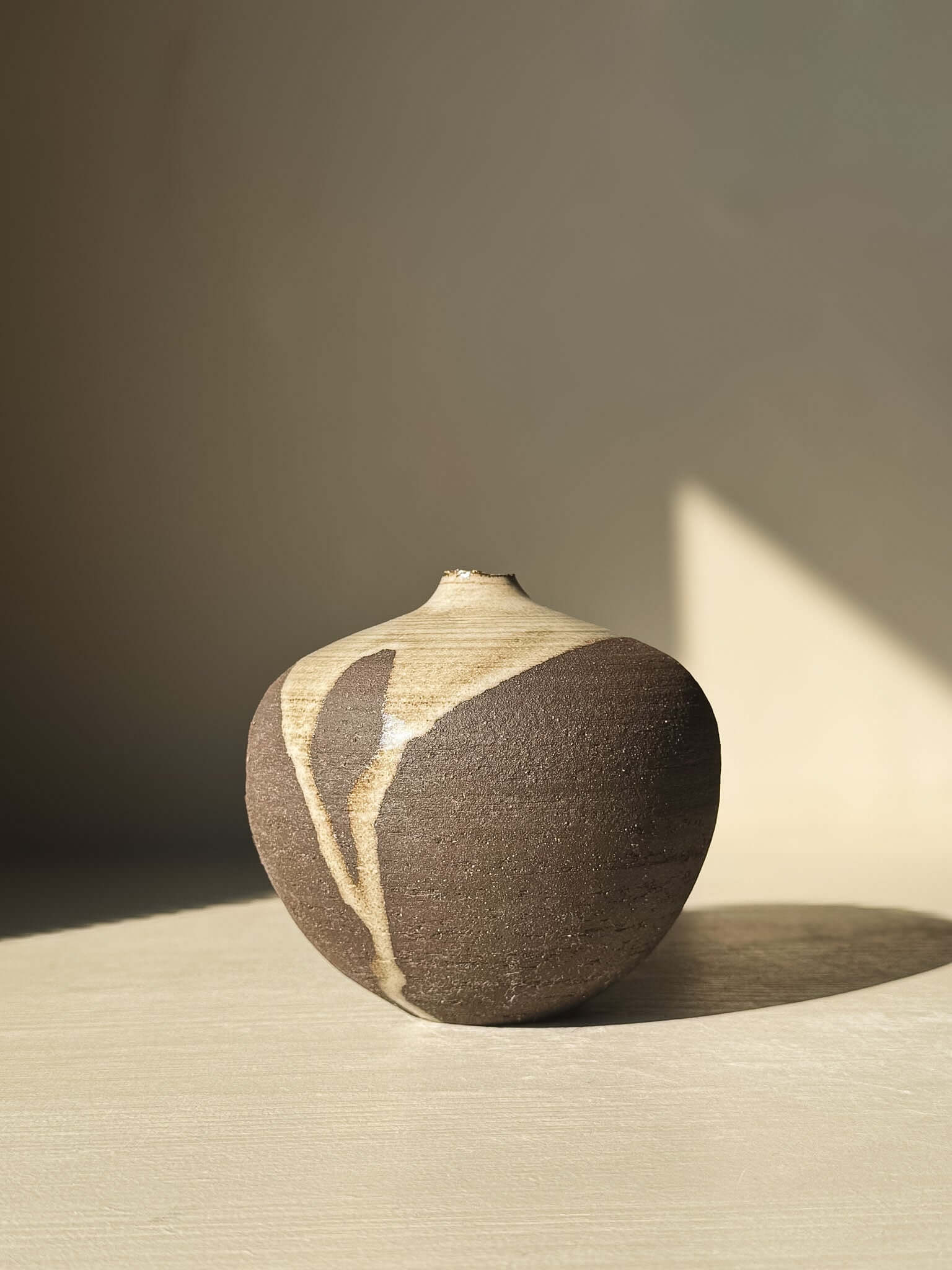 Orb Vase – #11 with unique glaze drips and organic patterns, showcasing a calm, sculptural spherical form. Ideal for minimalist decor.