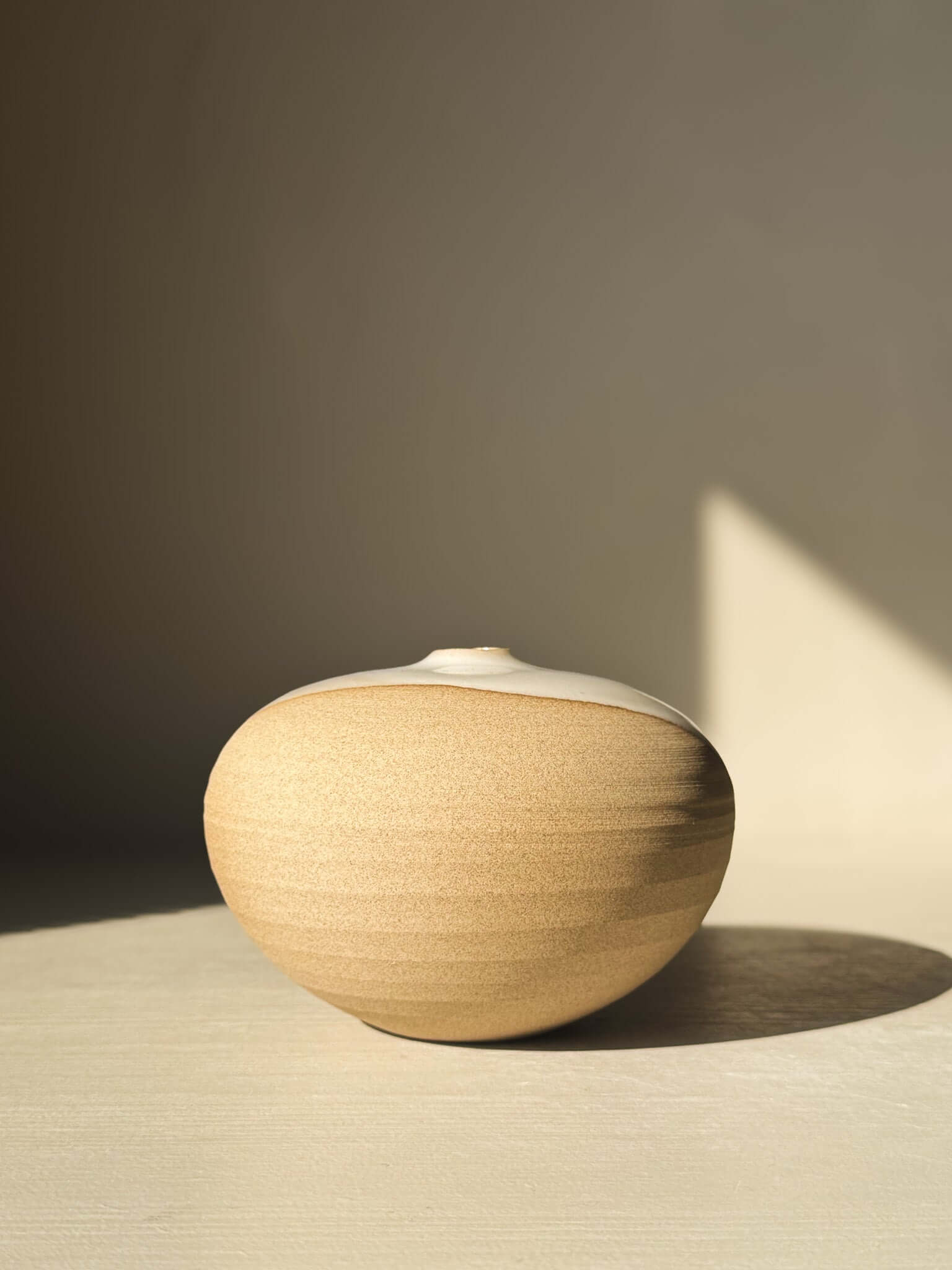 Natural clay Orb Vase – #09 with unique glaze patterns and rounded design