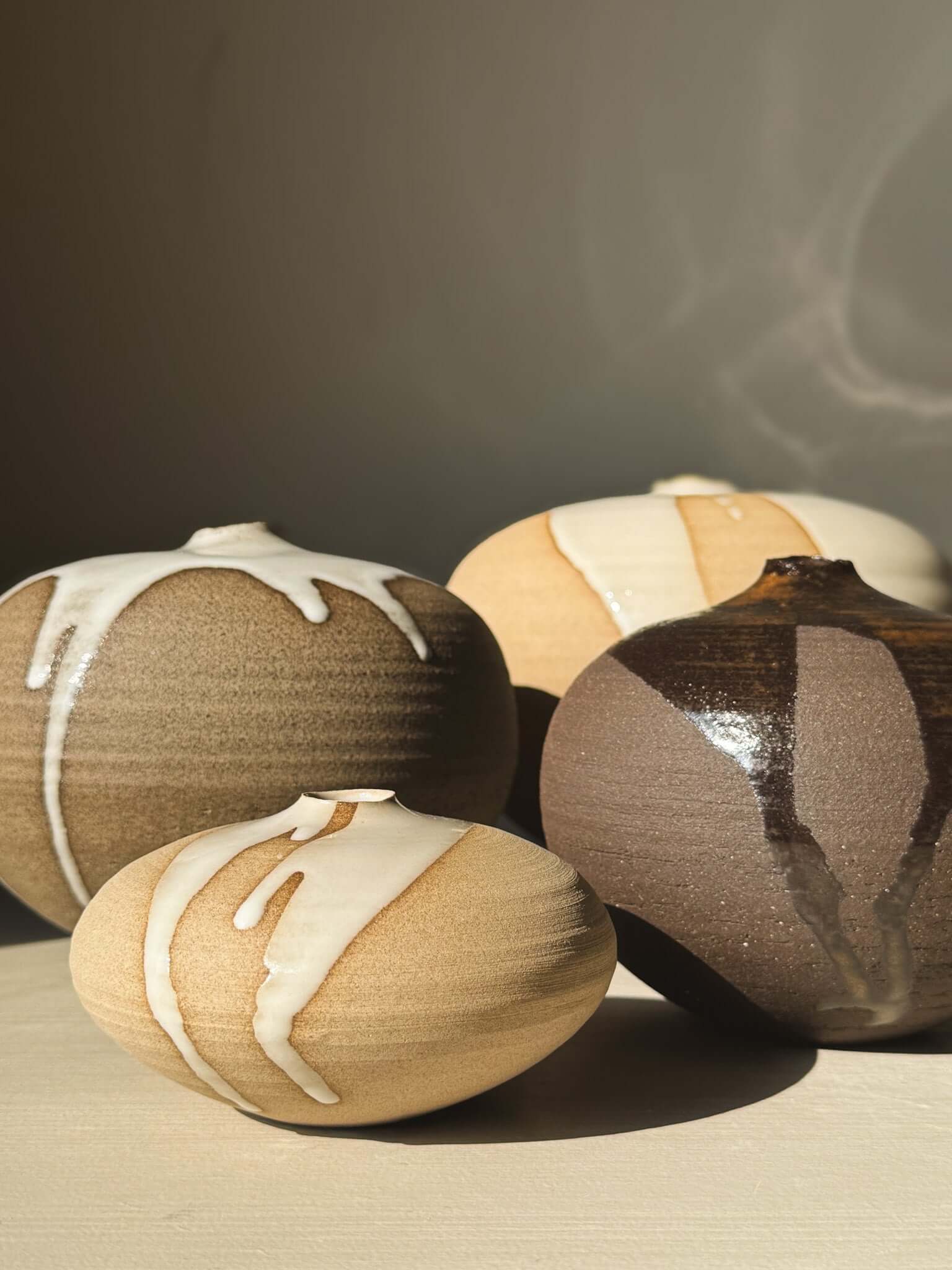 Four Orb Vase – #17 with unique glaze patterns and rounded shapes, showcasing a calm, sculptural presence.