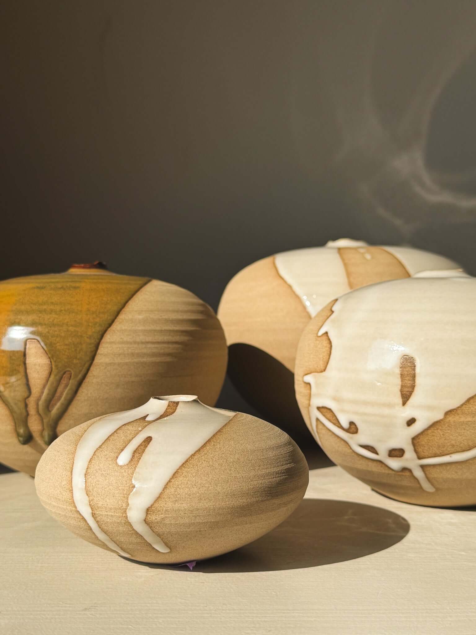 Orb Vase – #16 showcasing unique glaze patterns and sculptural soft spherical form.