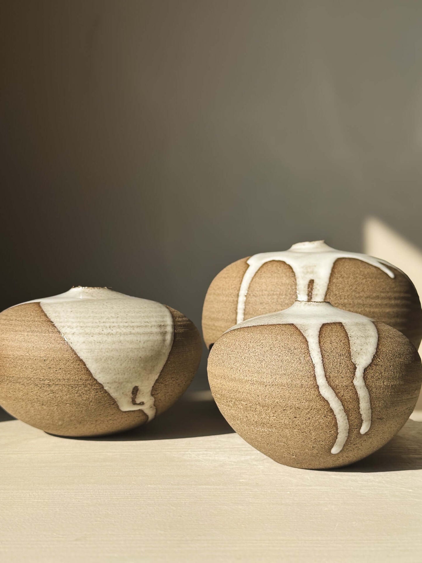 Orb Vase – #13 featuring unique glaze drips and organic patterns, part of a new collection of rounded clay vessels.