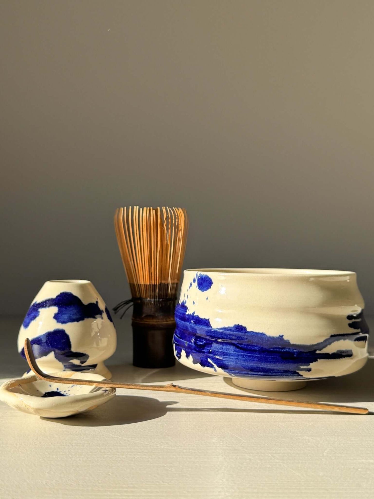 Matcha Bowl – Gosu Series #03 featuring deep blue cobalt glaze, part of a matcha tea set with bamboo whisk and tools.