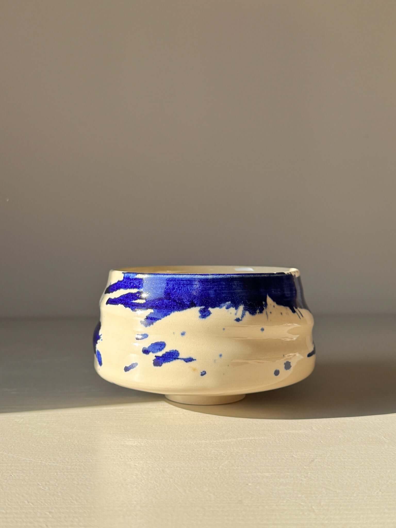 Matcha Bowl – Gosu Series #04 with cobalt glaze and rounded shape on display