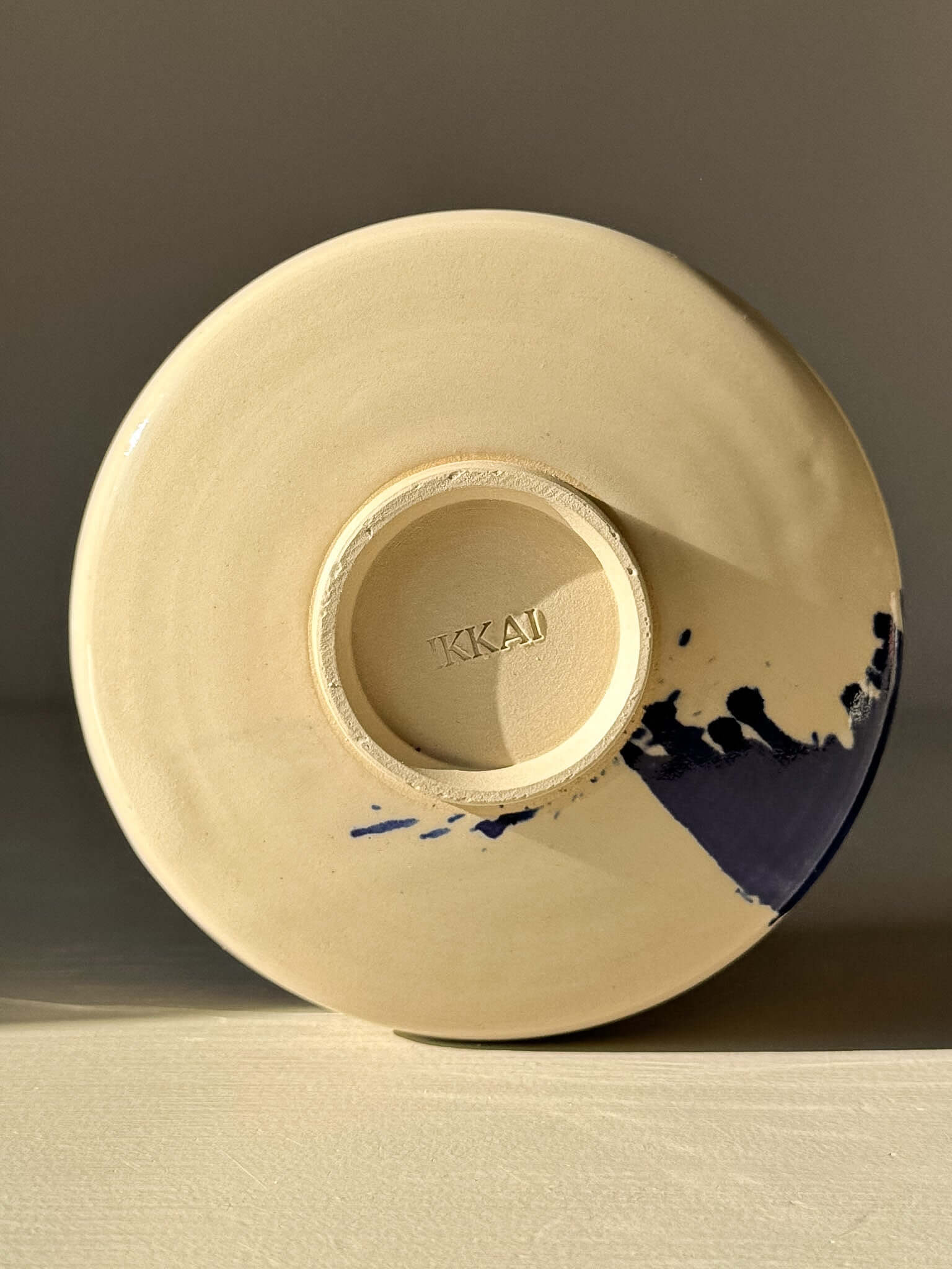 Bottom view of Matcha Bowl – Gosu Series #05 showcasing cobalt glaze pattern.