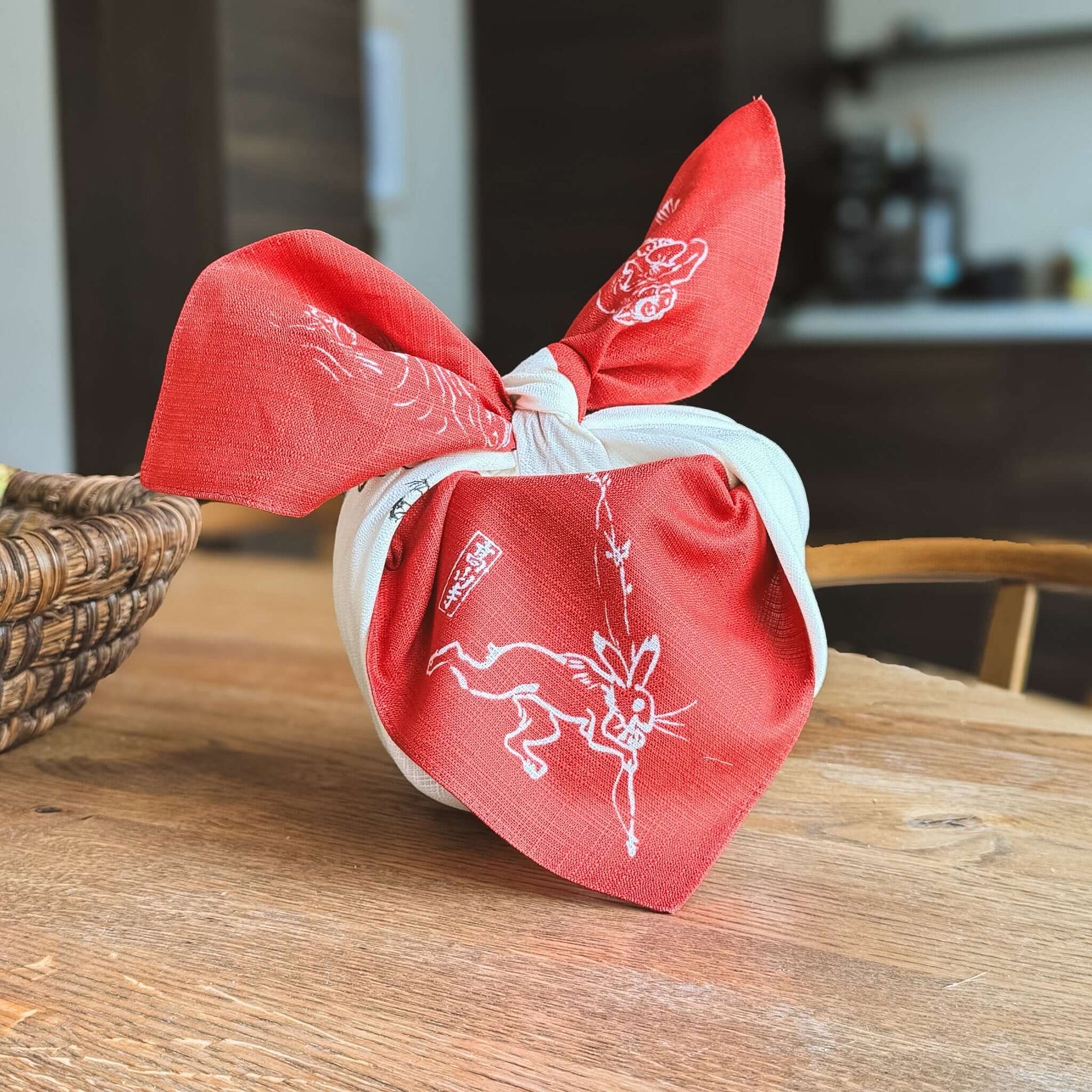 Medium Furoshiki Round Window Red featuring playful animal designs on a vibrant red background.