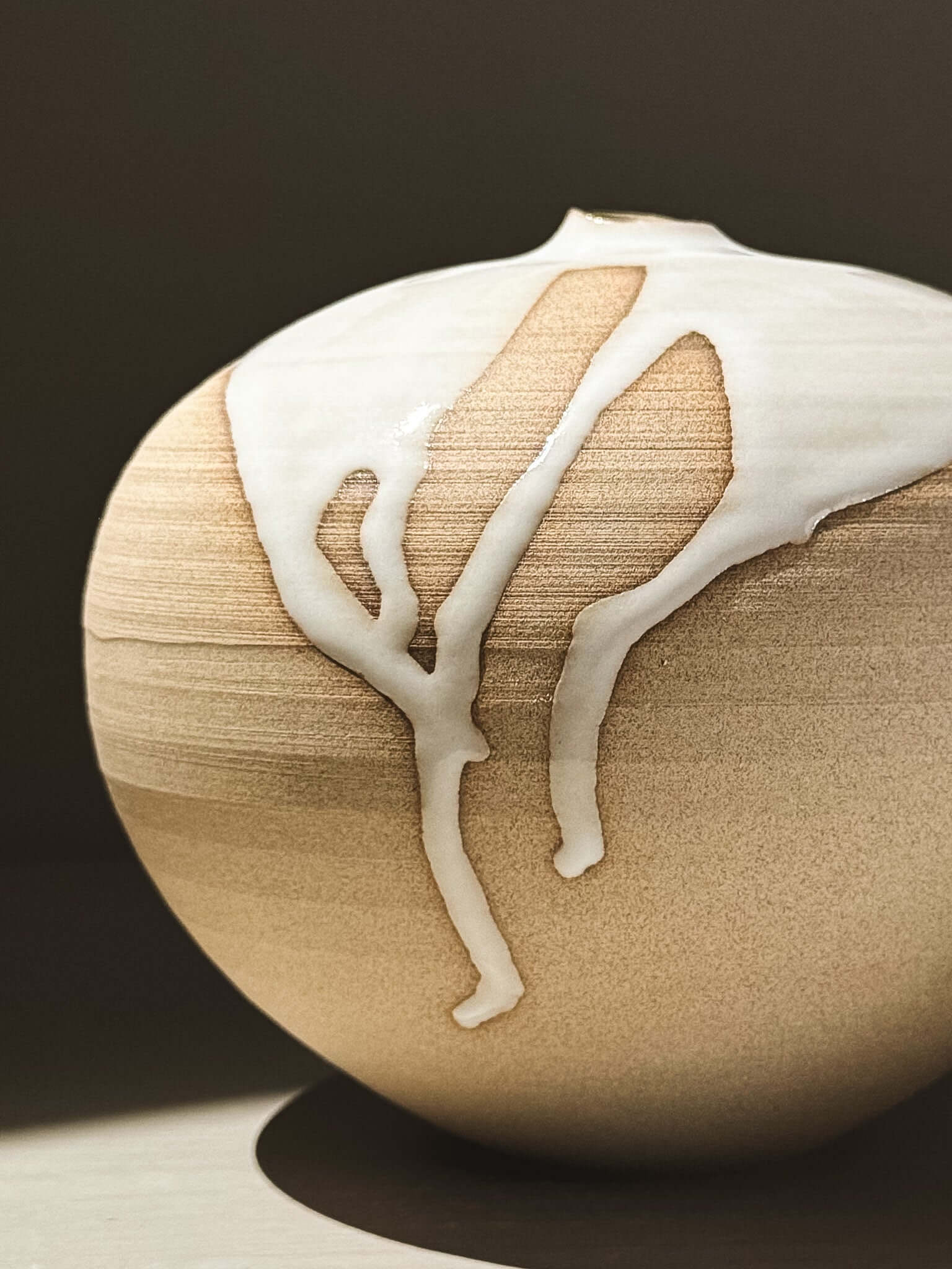 Orb Vase – Yuki #02 featuring unique glaze patterns on a soft spherical form.