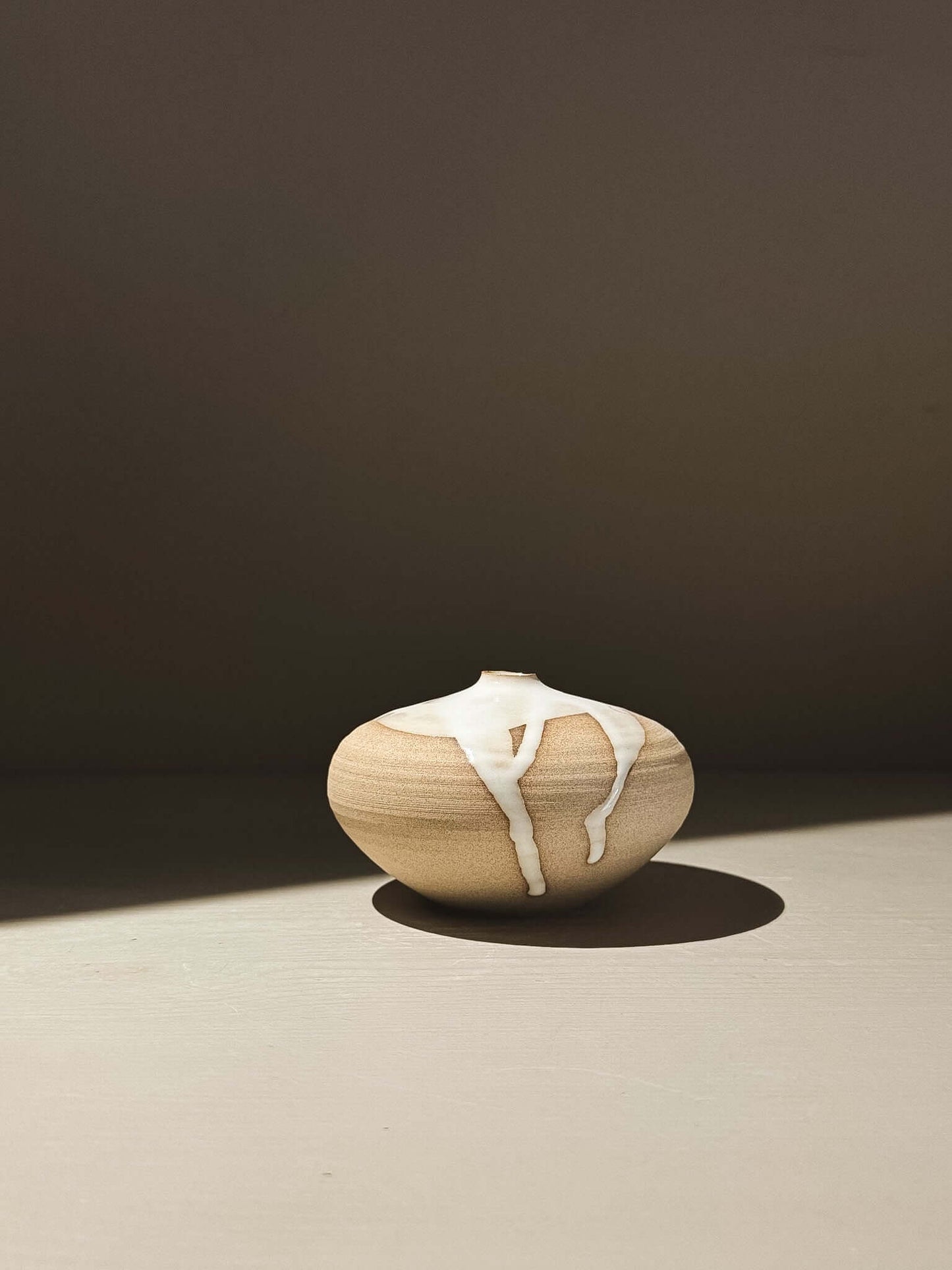 Orb Vase – Yuki #06 with unique glaze drips and soft spherical form, enhancing any decor.