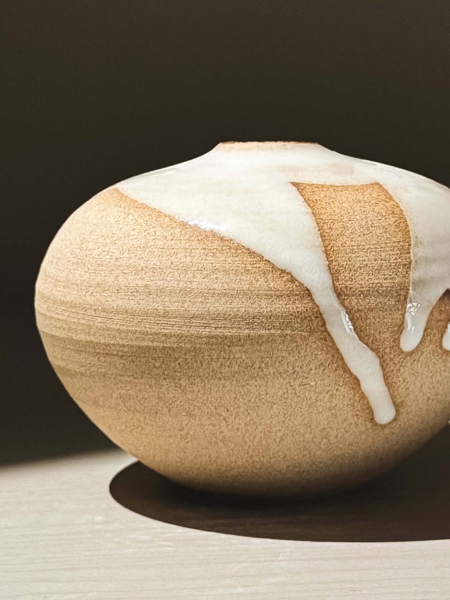 Orb Vase – Yuki #07 featuring a rounded shape and natural glaze drips, showcasing its unique design.