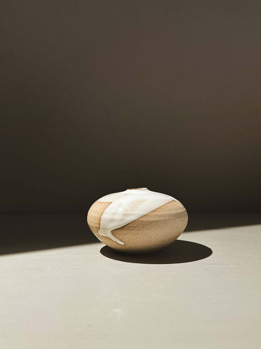 Orb Vase – Yuki #08 showcasing a unique rounded design with a soft glaze and natural patterns.