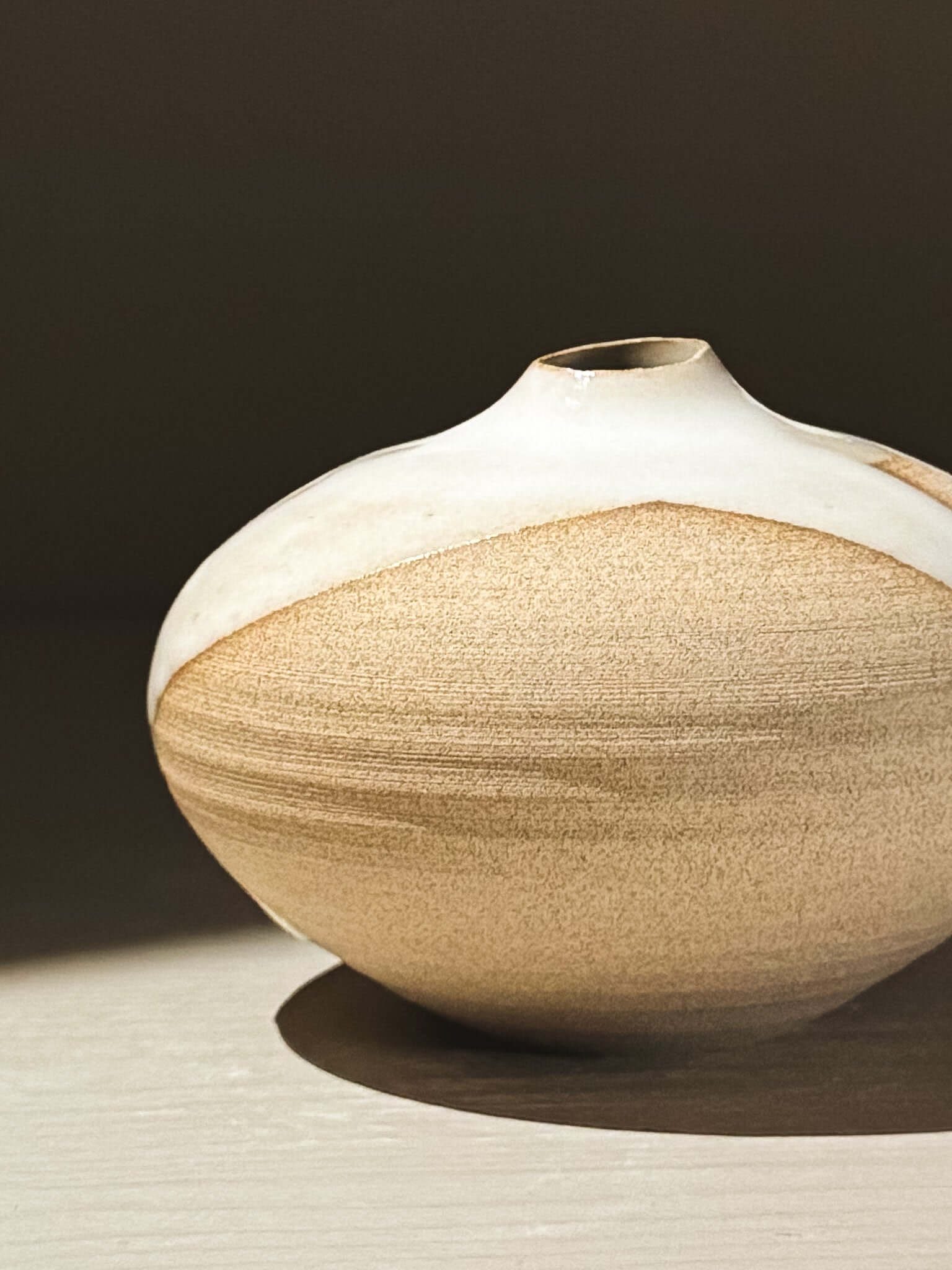 Orb Vase – Yuki #09 featuring unique glaze patterns and a soft spherical form.