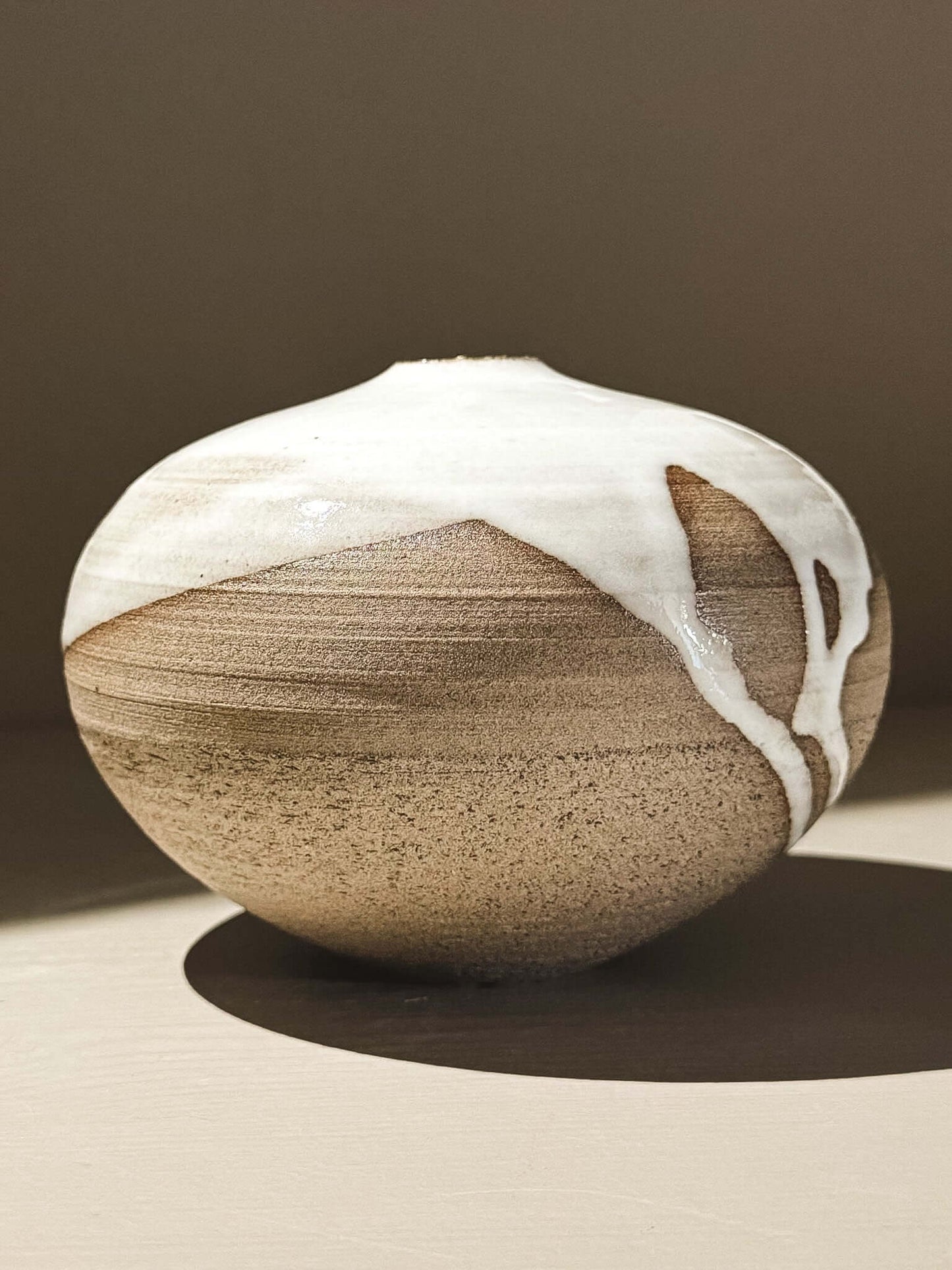 Orb Vase – Yuki Ash #01 with unique glaze and soft spherical form displayed on a neutral background.
