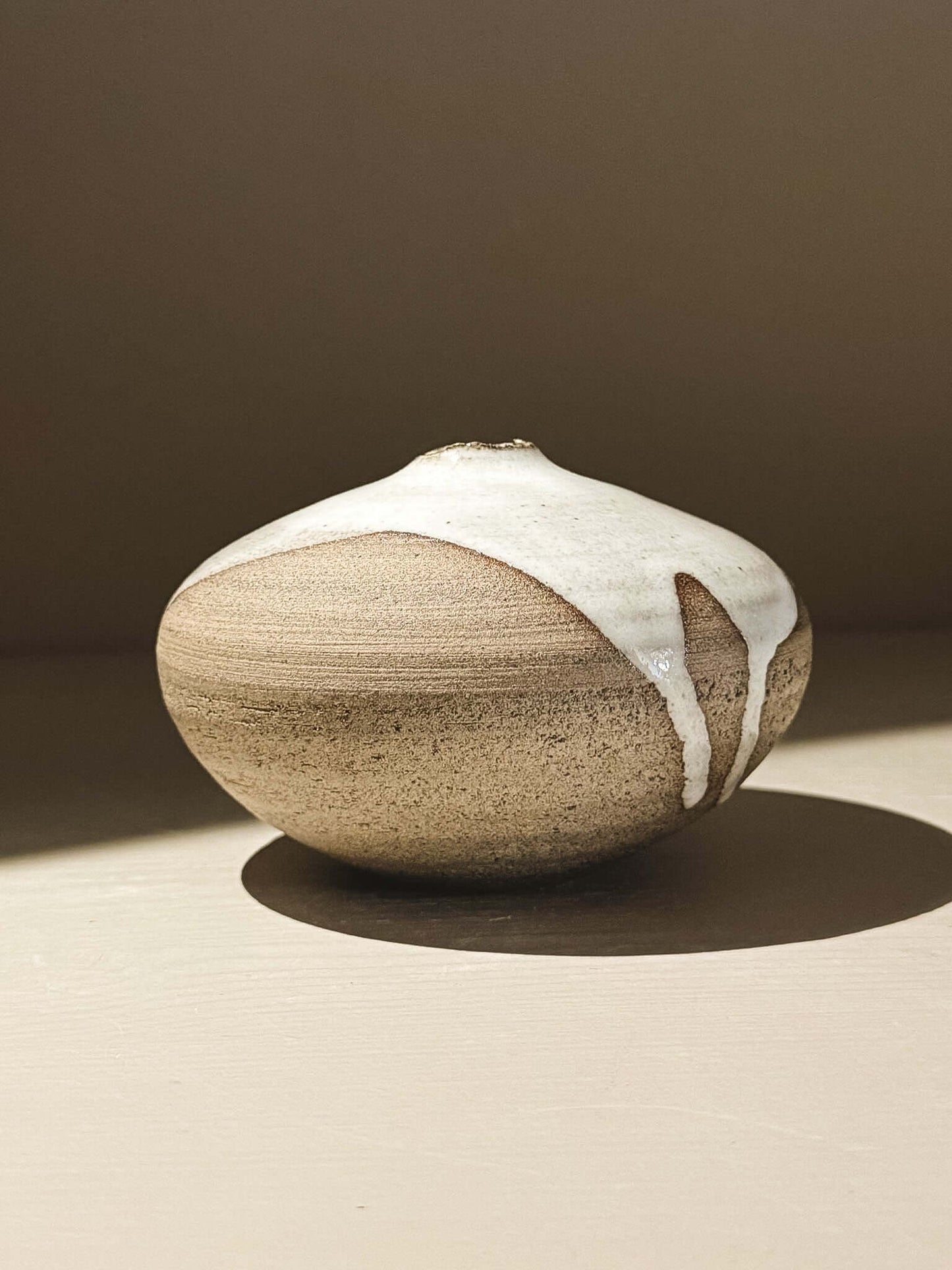 Orb Vase – Yuki Ash #03 showcasing its unique glaze and sculptural rounded form.