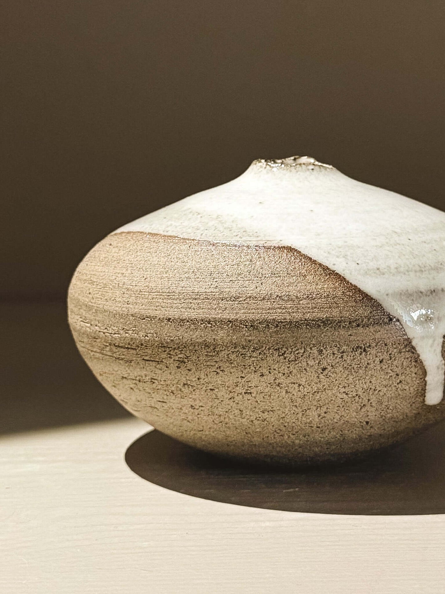 Orb Vase – Yuki Ash #03 in soft spherical form with unique glaze patterns and gentle drips, showcasing organic beauty.