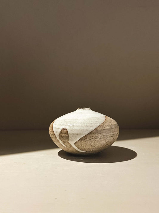 Orb Vase – Yuki Ash #03 in soft spherical form with unique glaze patterns and gentle drips.