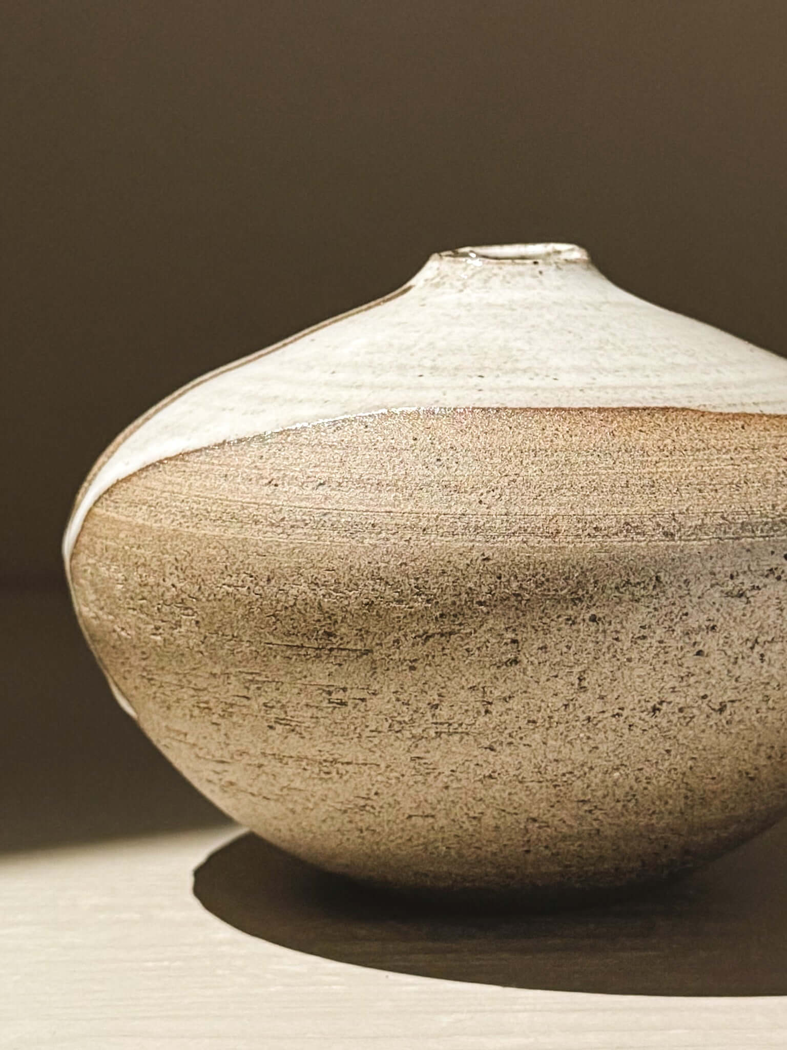 Orb Vase – Yuki Ash #04 with a soft spherical form and organic glaze patterns.