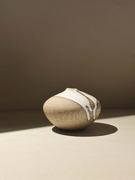 Orb Vase – Yuki Ash #04 showcasing unique glaze patterns and a soft, sculptural form in natural light.