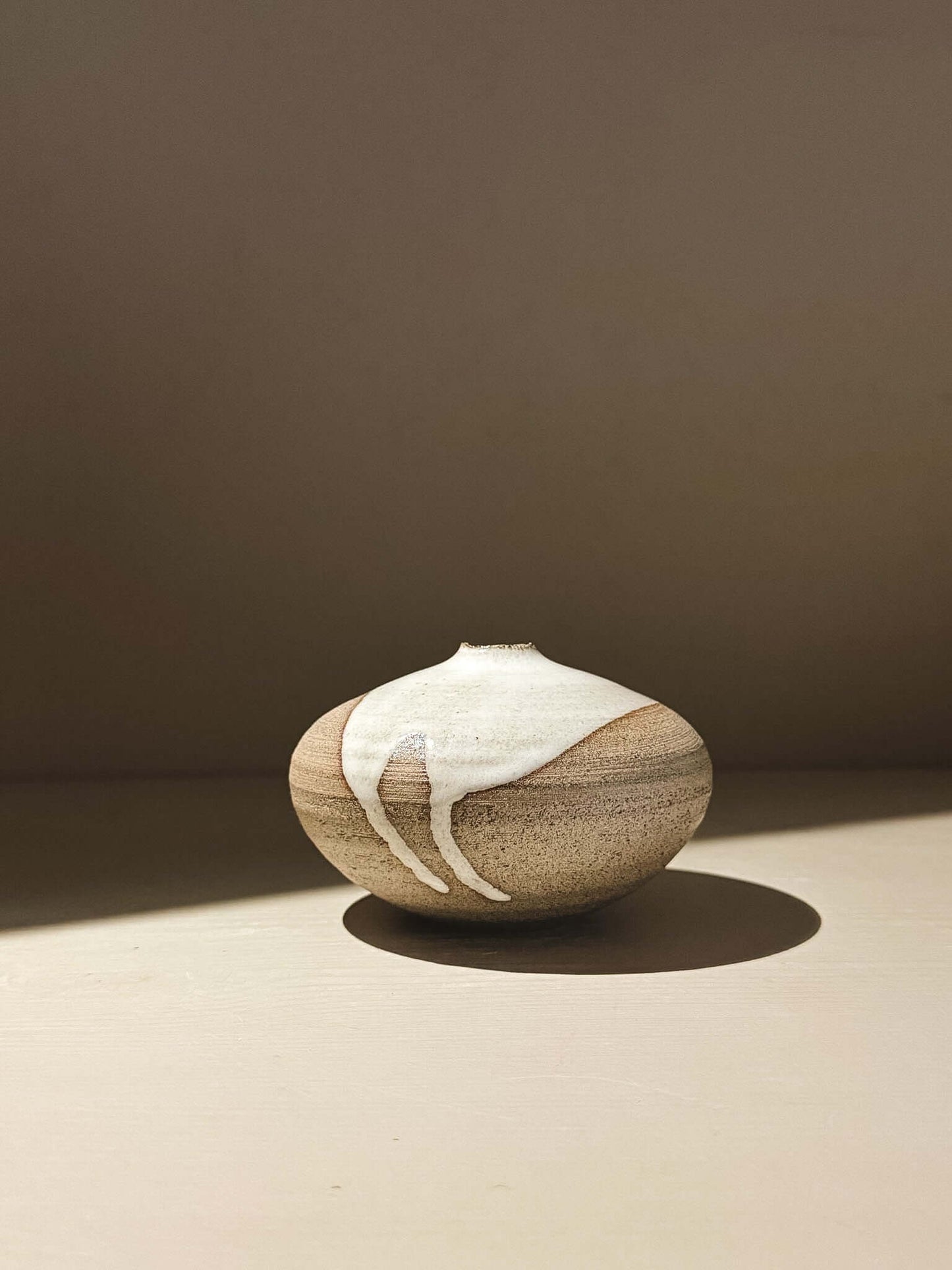 Orb Vase – Yuki Ash #05 with unique glaze patterns and rounded sculptural form.